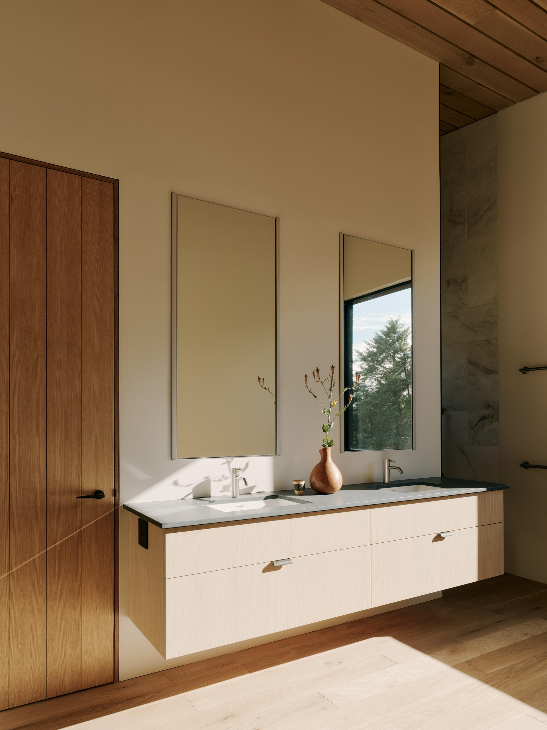 Bathrooms are planned with durability and accessibility in mind, focusing on function over short-term trends.