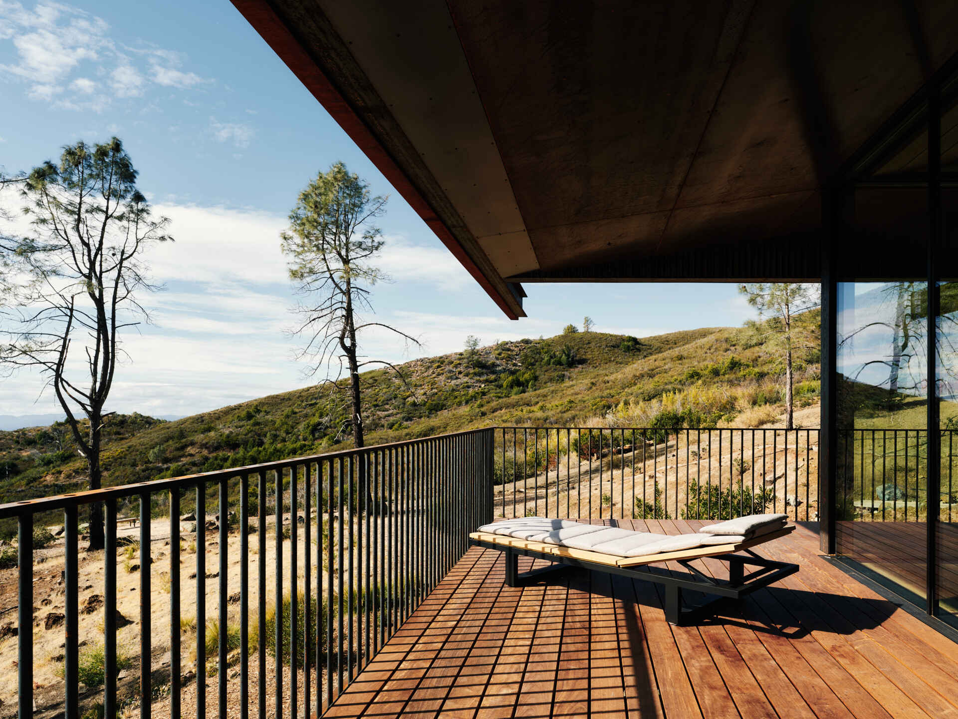 This elevated deck is designed with overhead sprinklers and smart drainage, turning outdoor living into a more resilient experience.