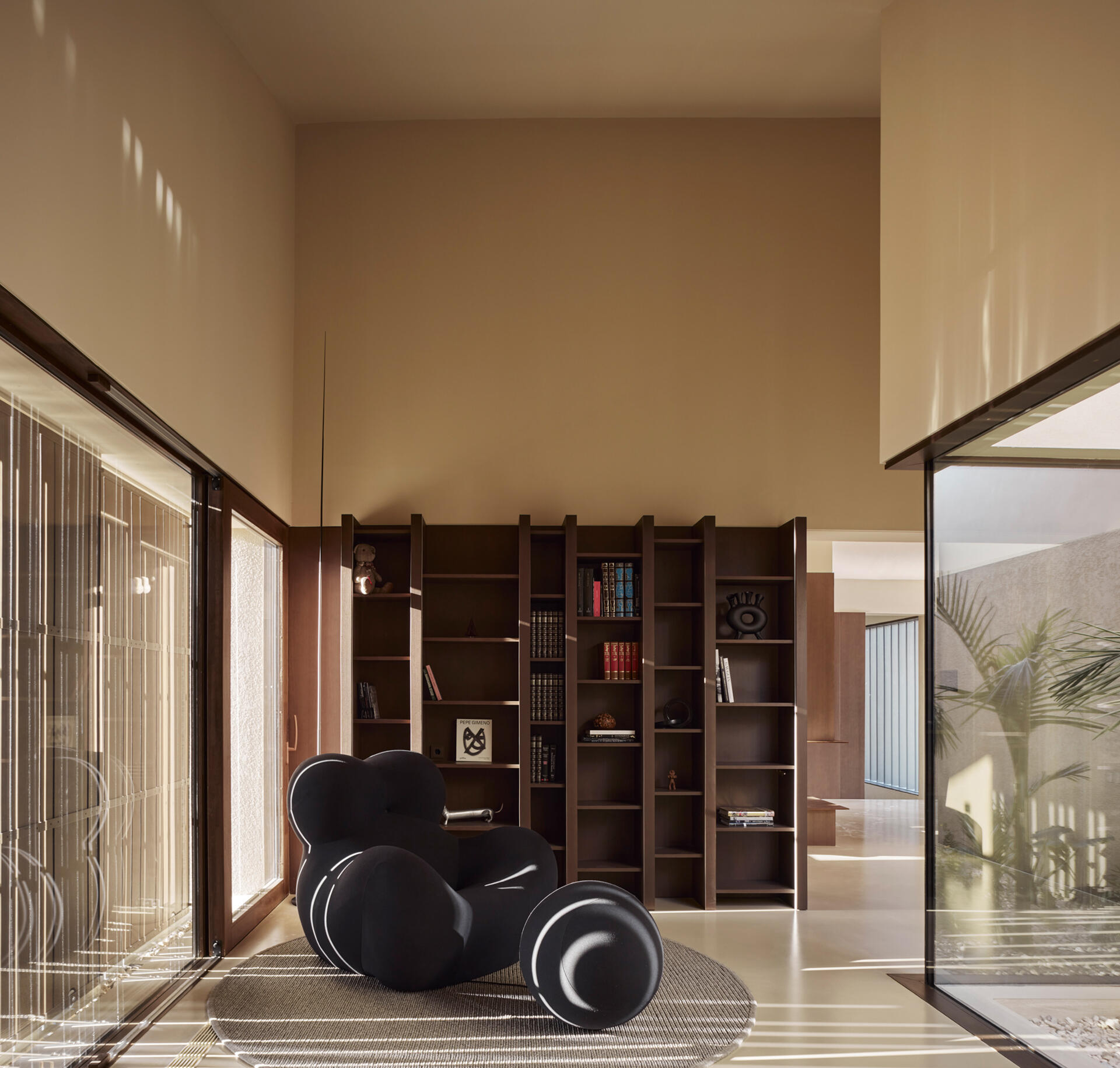 A simple hallway separates public and private spaces, guiding movement through the home with clarity and ease.