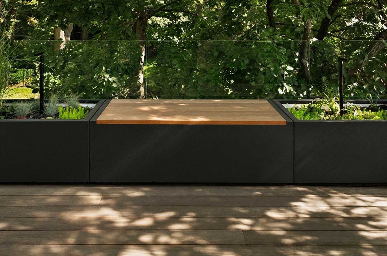 Custom wood planters cleverly hide rooftop equipment while doubling as design features that adapt through the seasons.