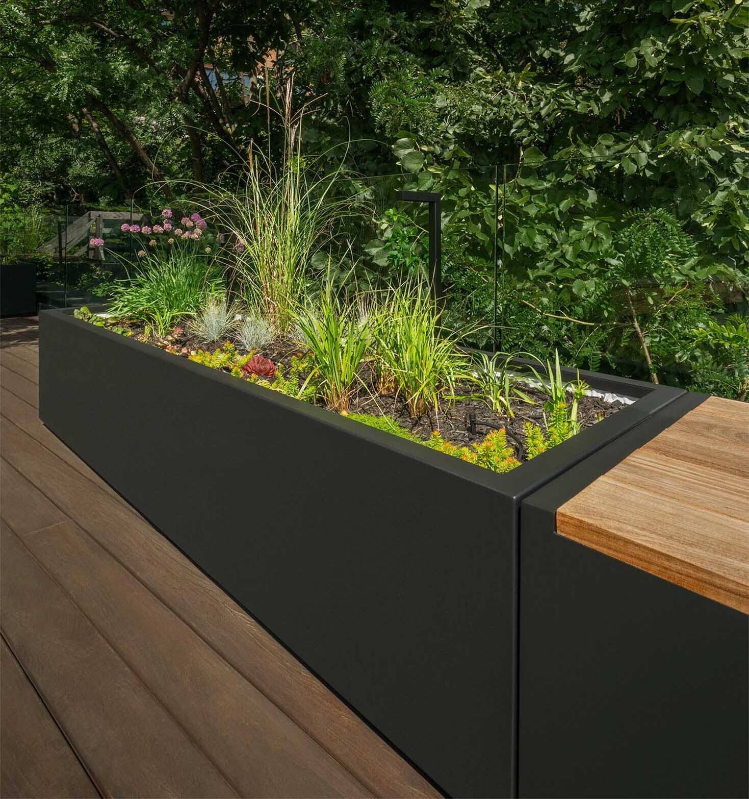 Custom wood planters cleverly hide rooftop equipment while doubling as design features that adapt through the seasons.
