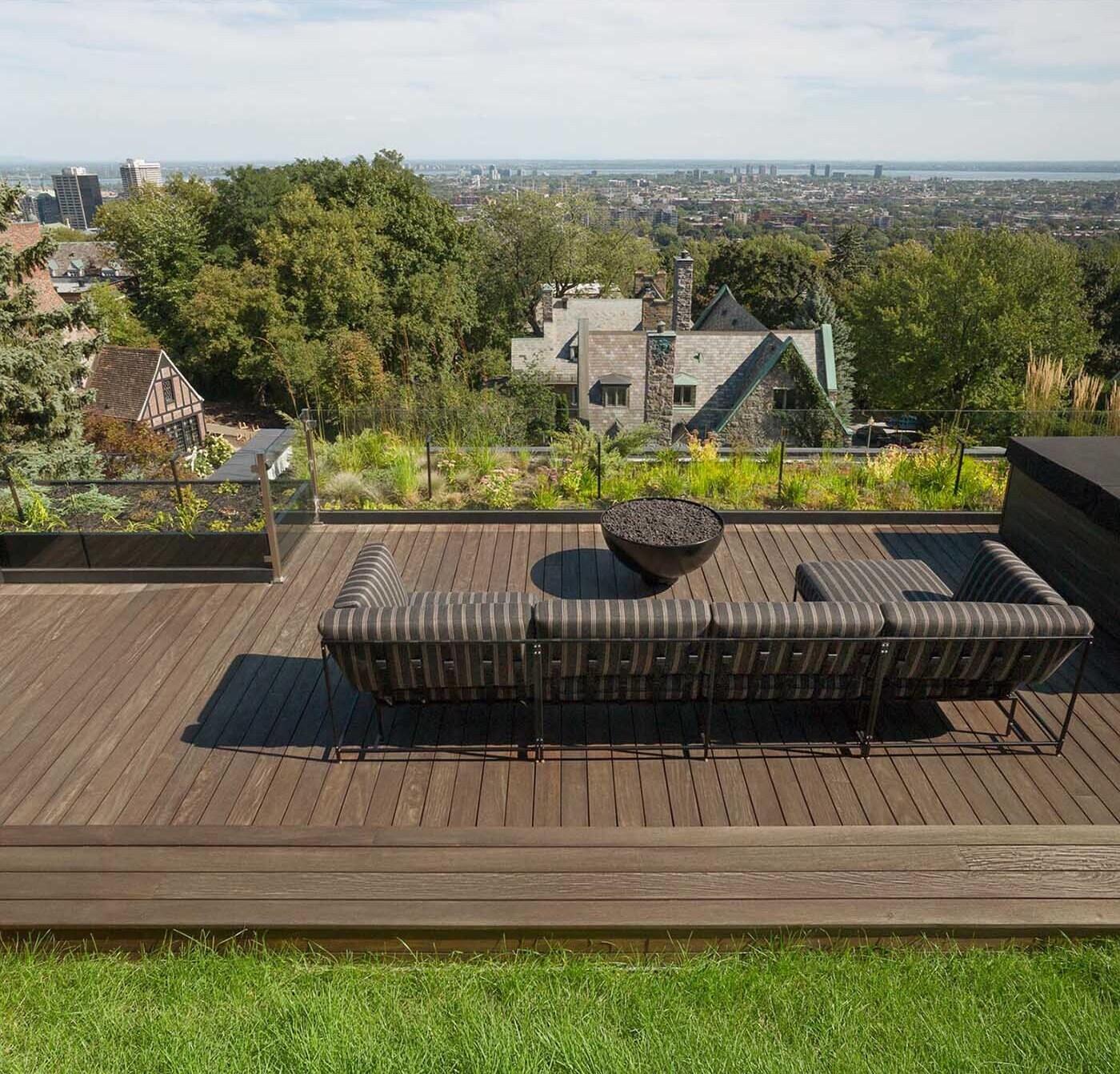 Ipe wood decking adds warmth and durability to this rooftop, grounding the space with its rich tone and solid feel.