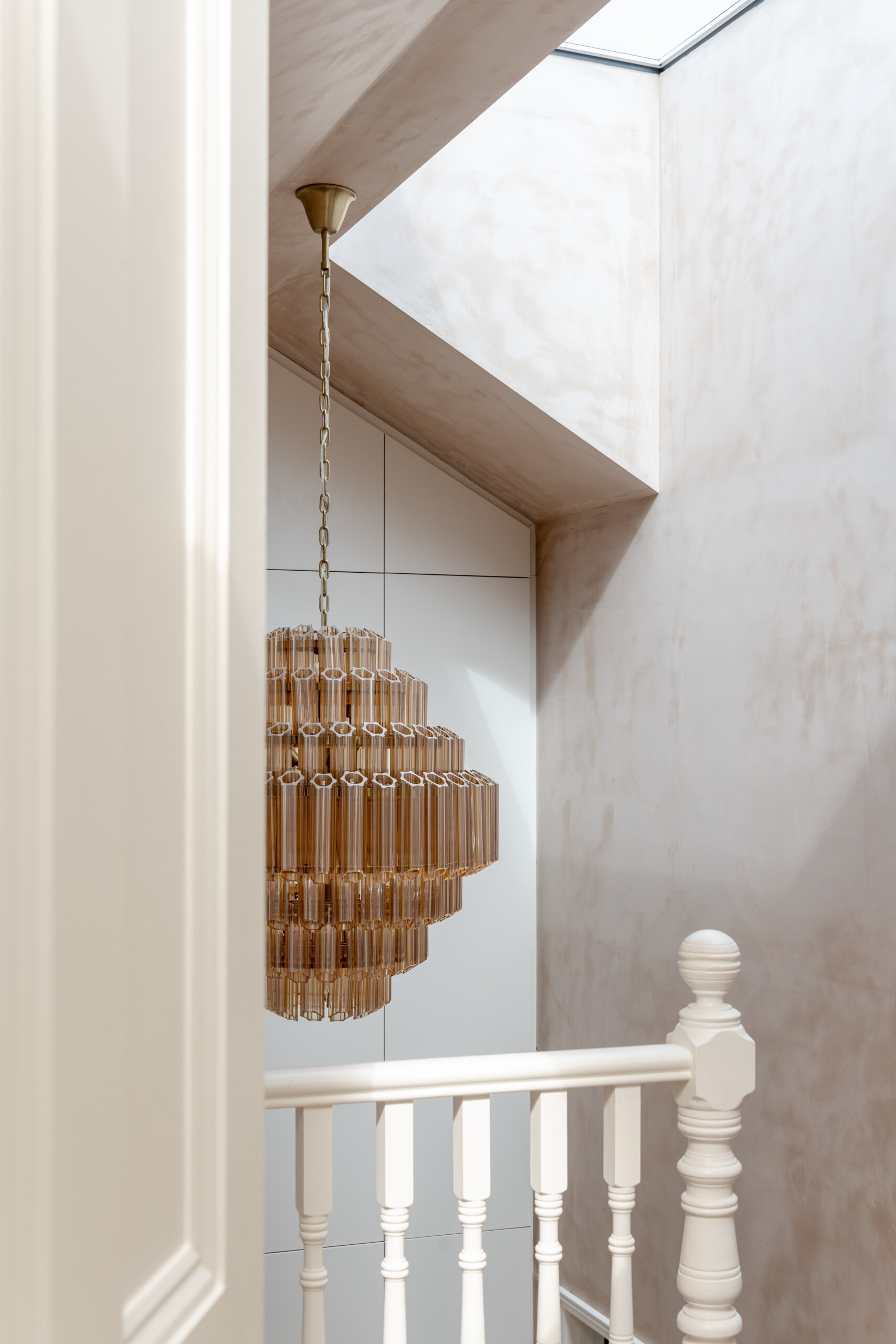 The original stairs remain part of the Edwardian structure, alongside preserved timber beams, cornicing, and tiled floors that maintain the home’s historic character.