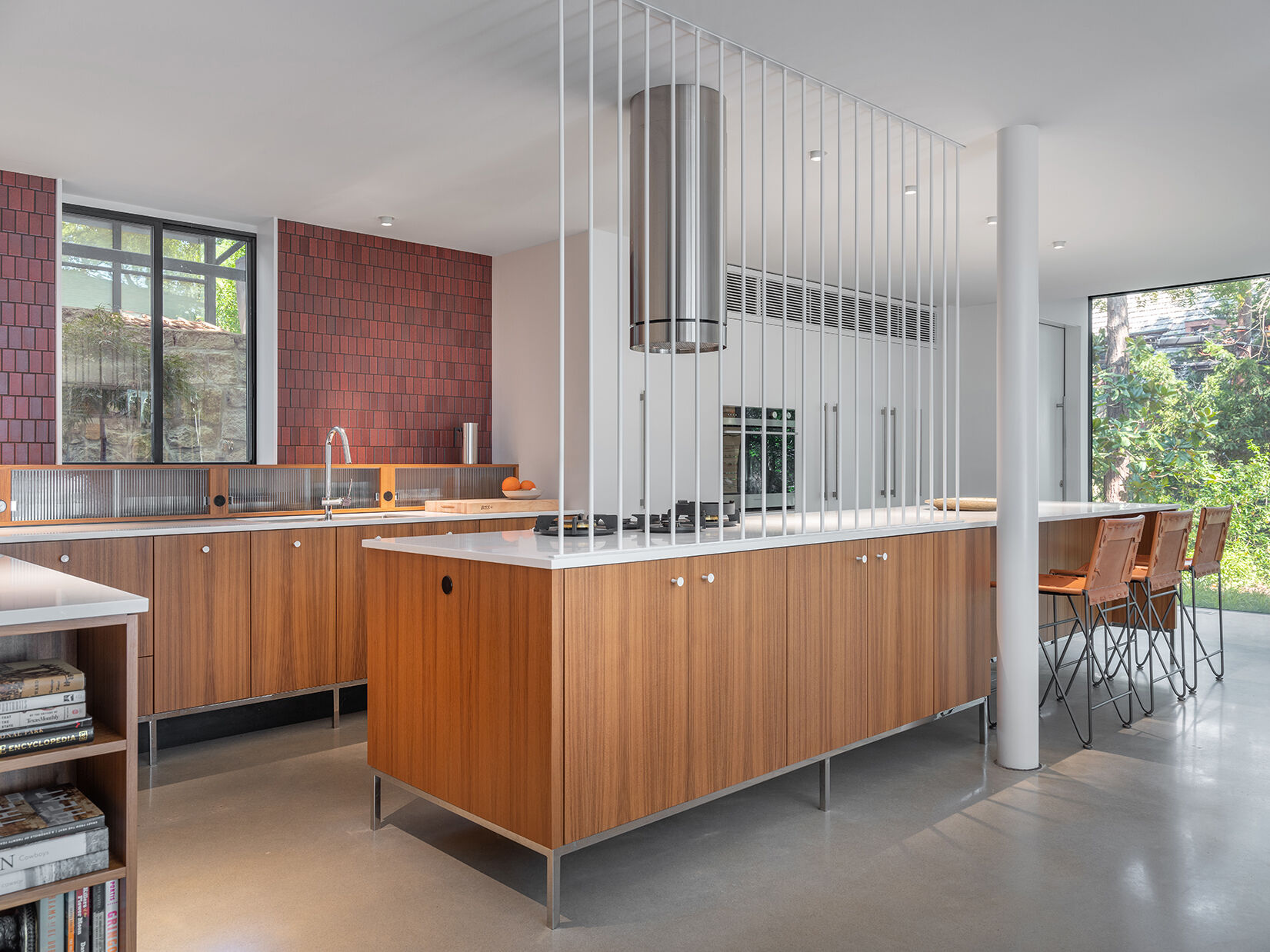 In this mid-century modern inspired kitchen, clean lines and a furniture-like design keep the space open while still providing full functionality.