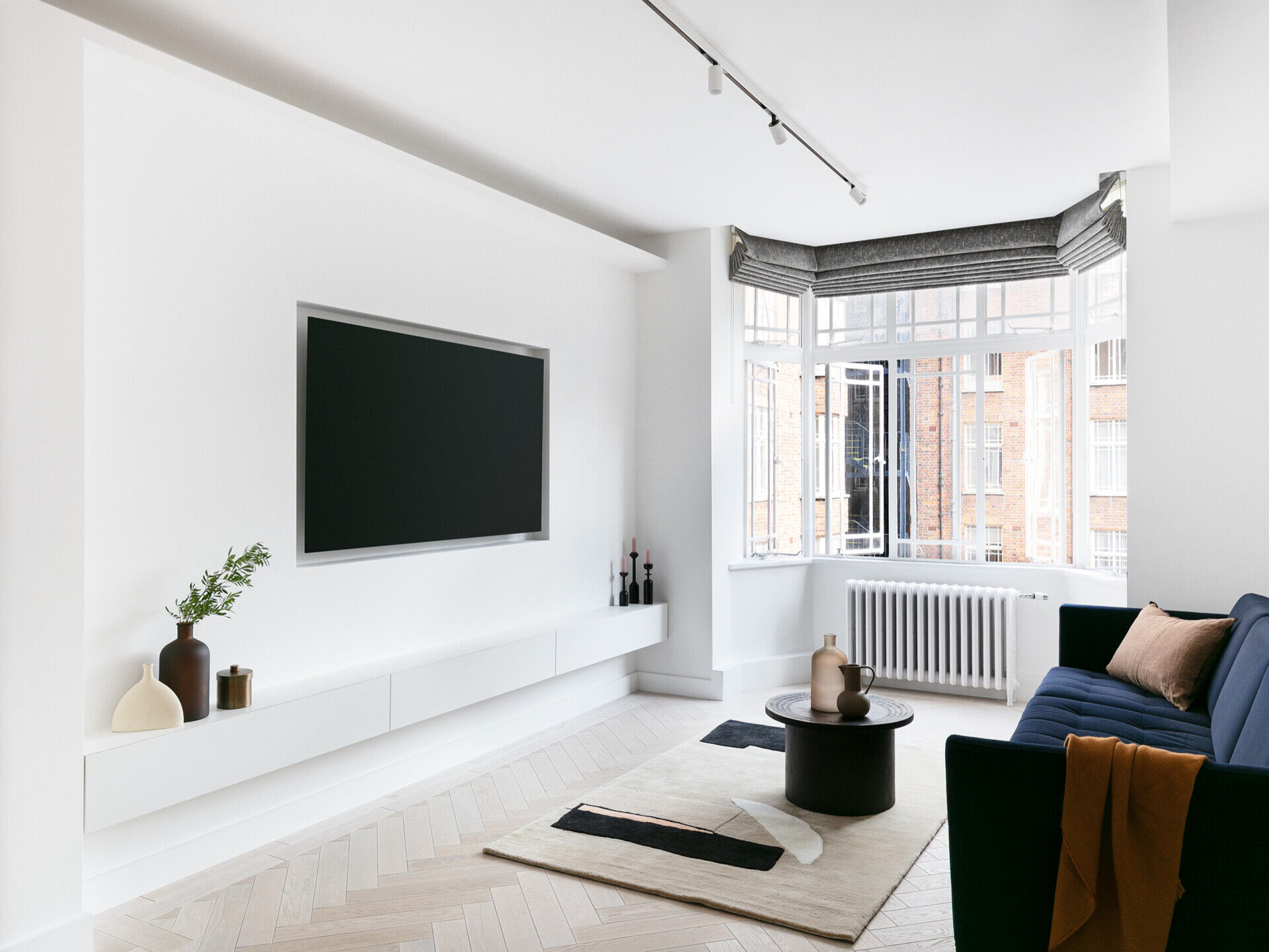 Concealed LED lighting creates a soft, continuous glow across this modern London living space.