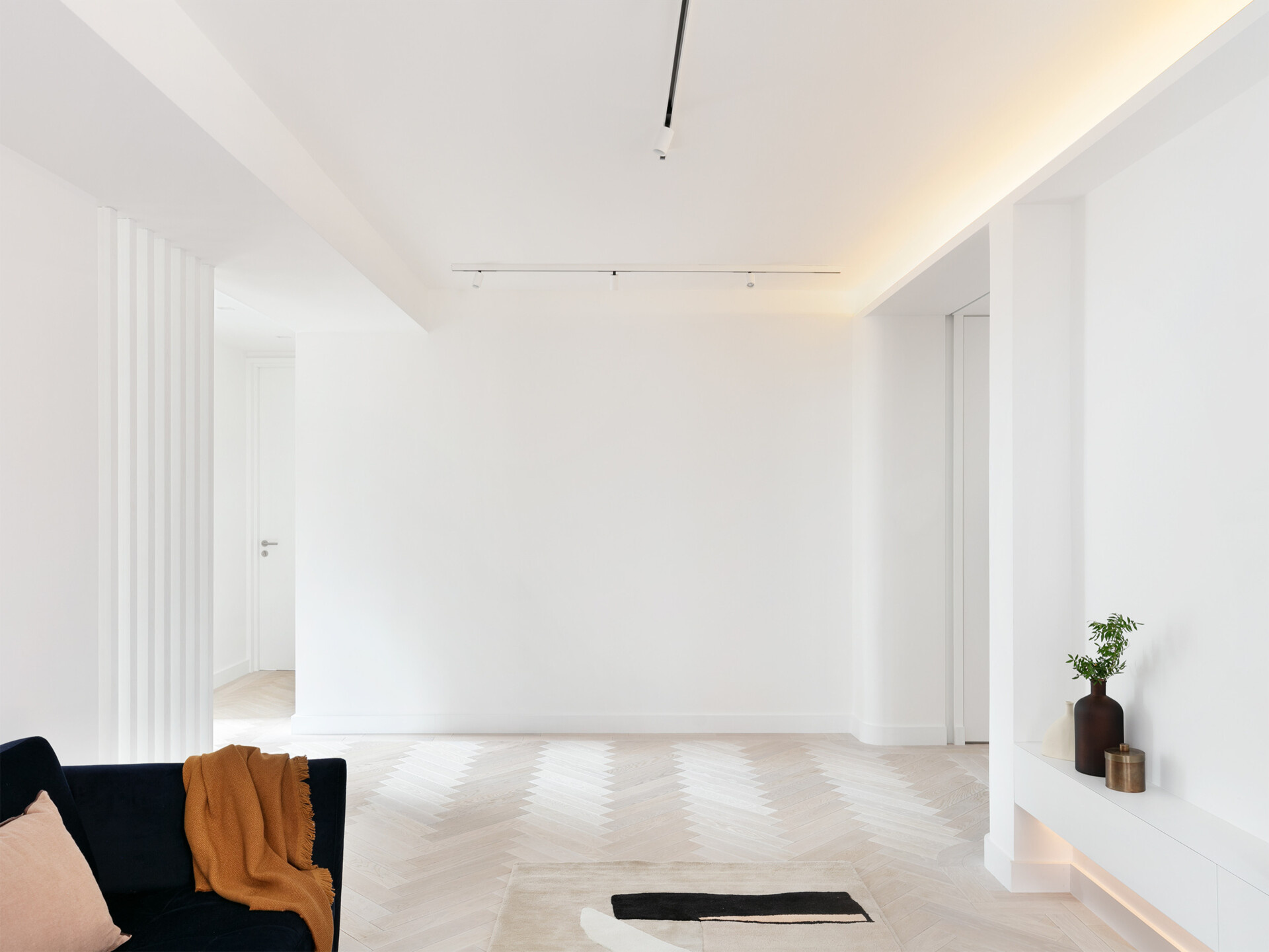 Concealed LED lighting creates a soft, continuous glow across this modern London living space.