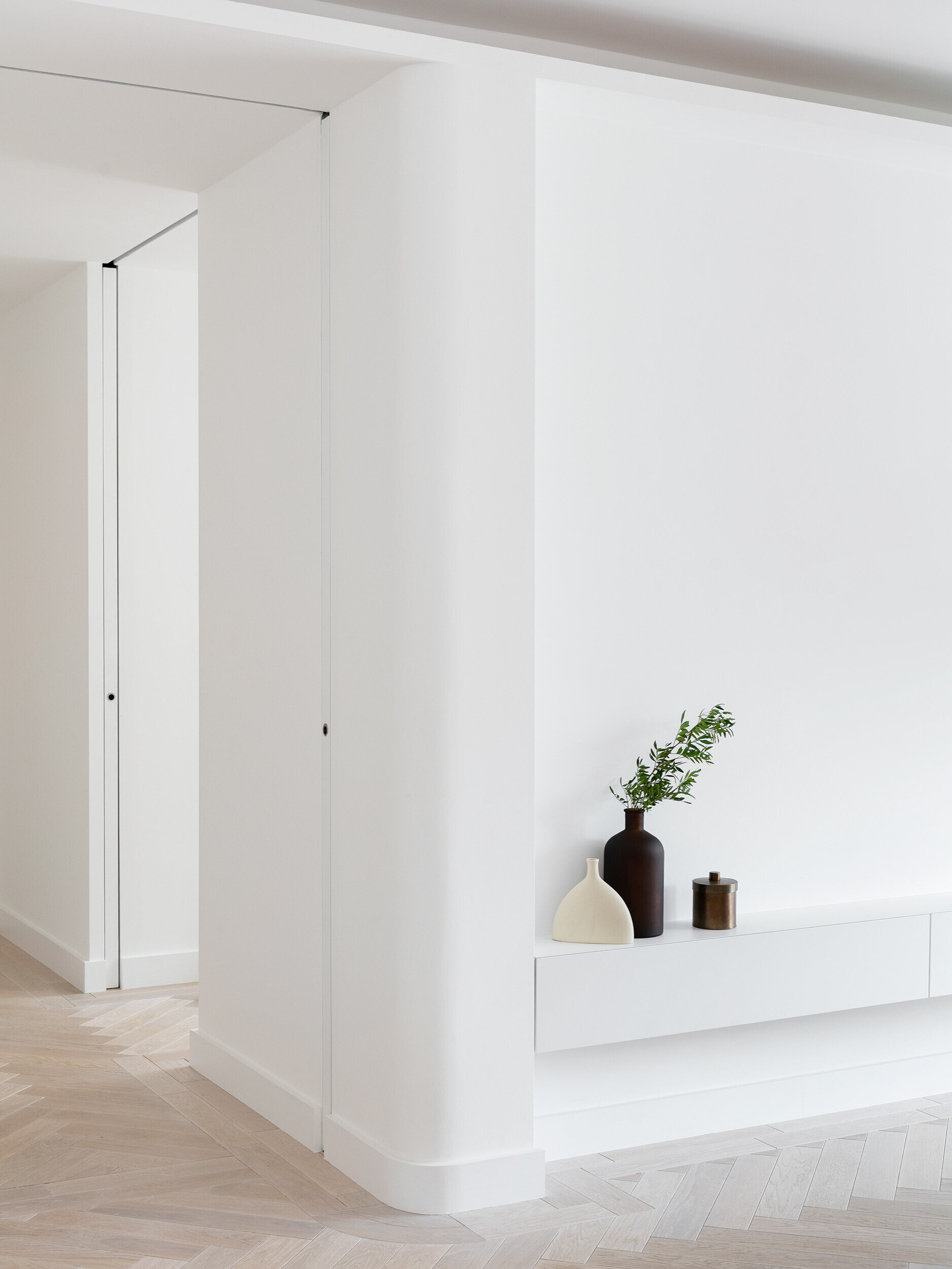 Concealed LED lighting creates a soft, continuous glow across this modern London living space.