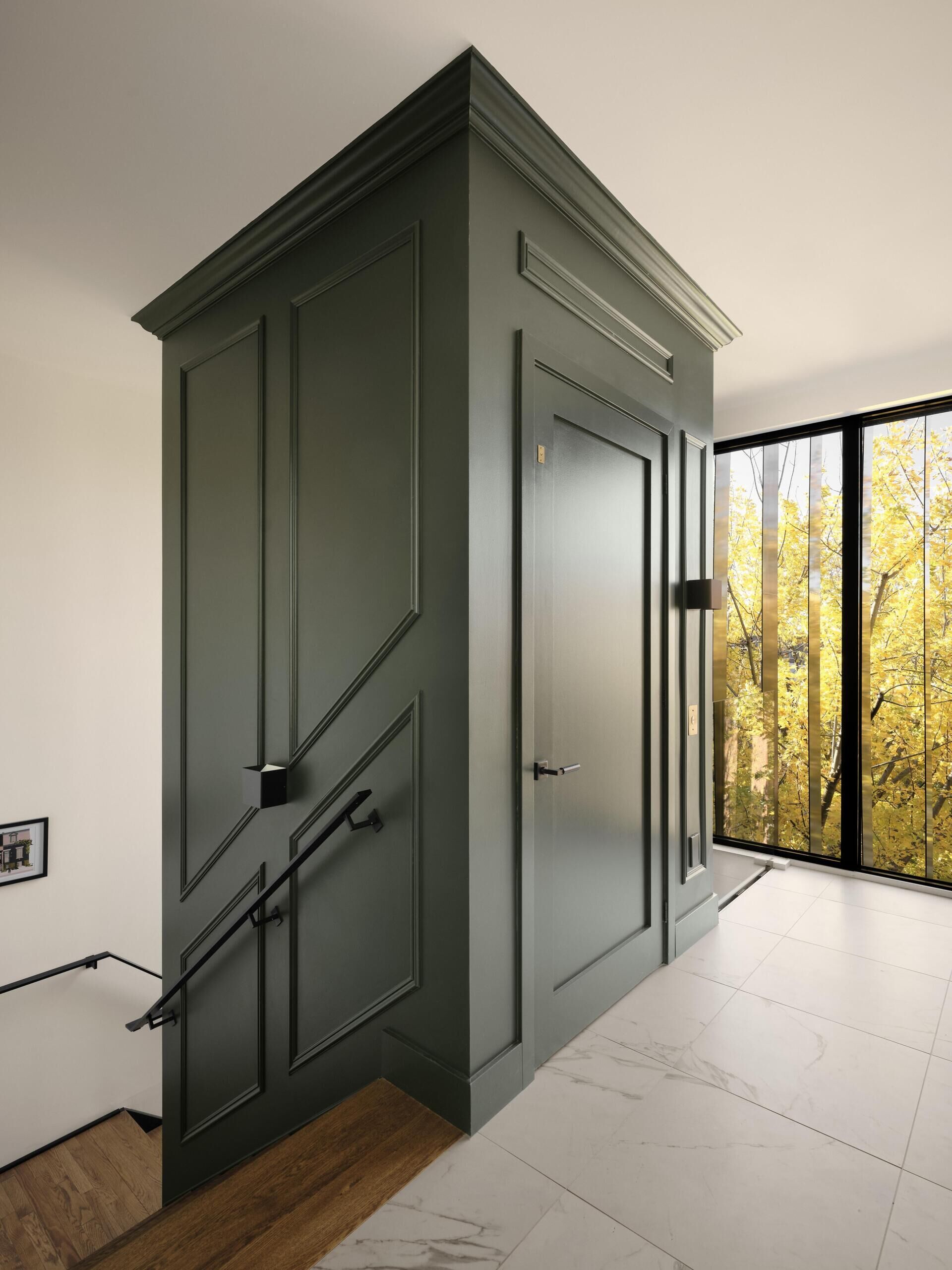 The elevator sits at the heart of the extension, linking all floors without interrupting the overall design. It is integrated into the layout so it feels like a natural part of the home, not an afterthought. Around it, the staircase offers an alternative route, creating a shared circulation system that works for everyone.