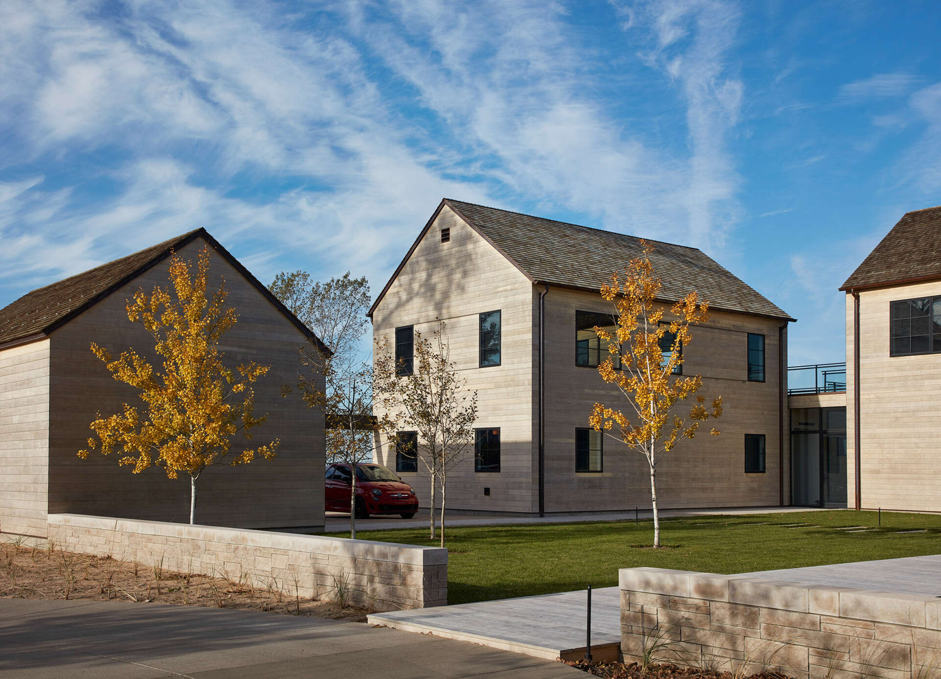 This modern house features Accoya wood siding and cedar shingles that create a durable, weather-ready exterior designed for life by the lake.