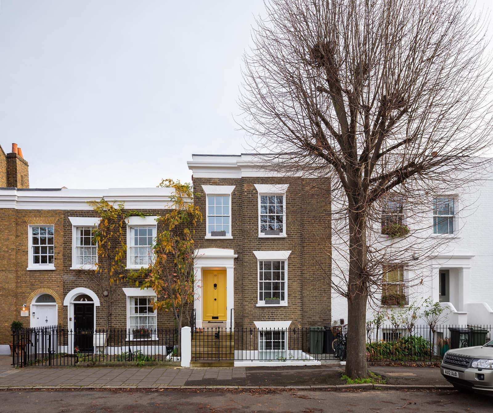 A restored Georgian London terrace blends classic architecture with a clean, modern extension at the rear.
