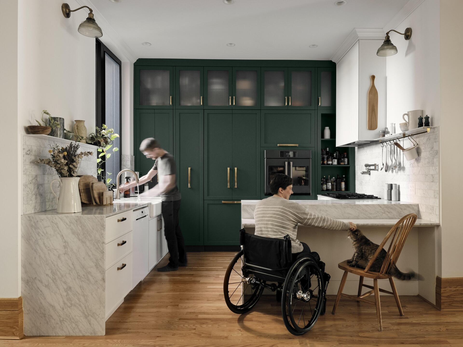 A smart kitchen layout with dual-height surfaces and wider pathways makes cooking accessible and practical.