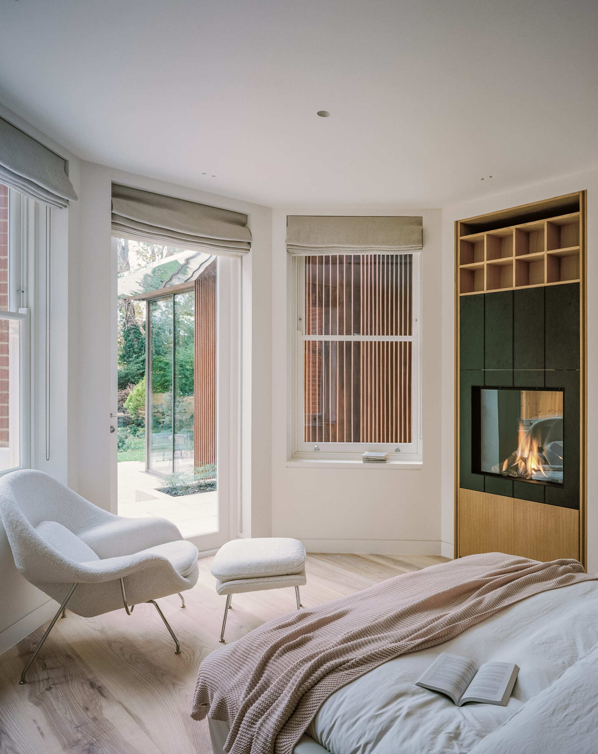 A bedroom with its own fireplace offers a quieter, more intimate atmosphere within the home.