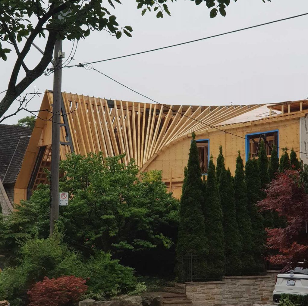 A behind-the-scenes look at how steel and timber come together to form this complex curved roof.