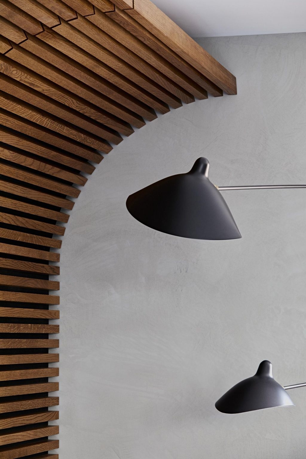 A close-up reveals the craftsmanship behind this curved wood wall as it transitions seamlessly into the ceiling.