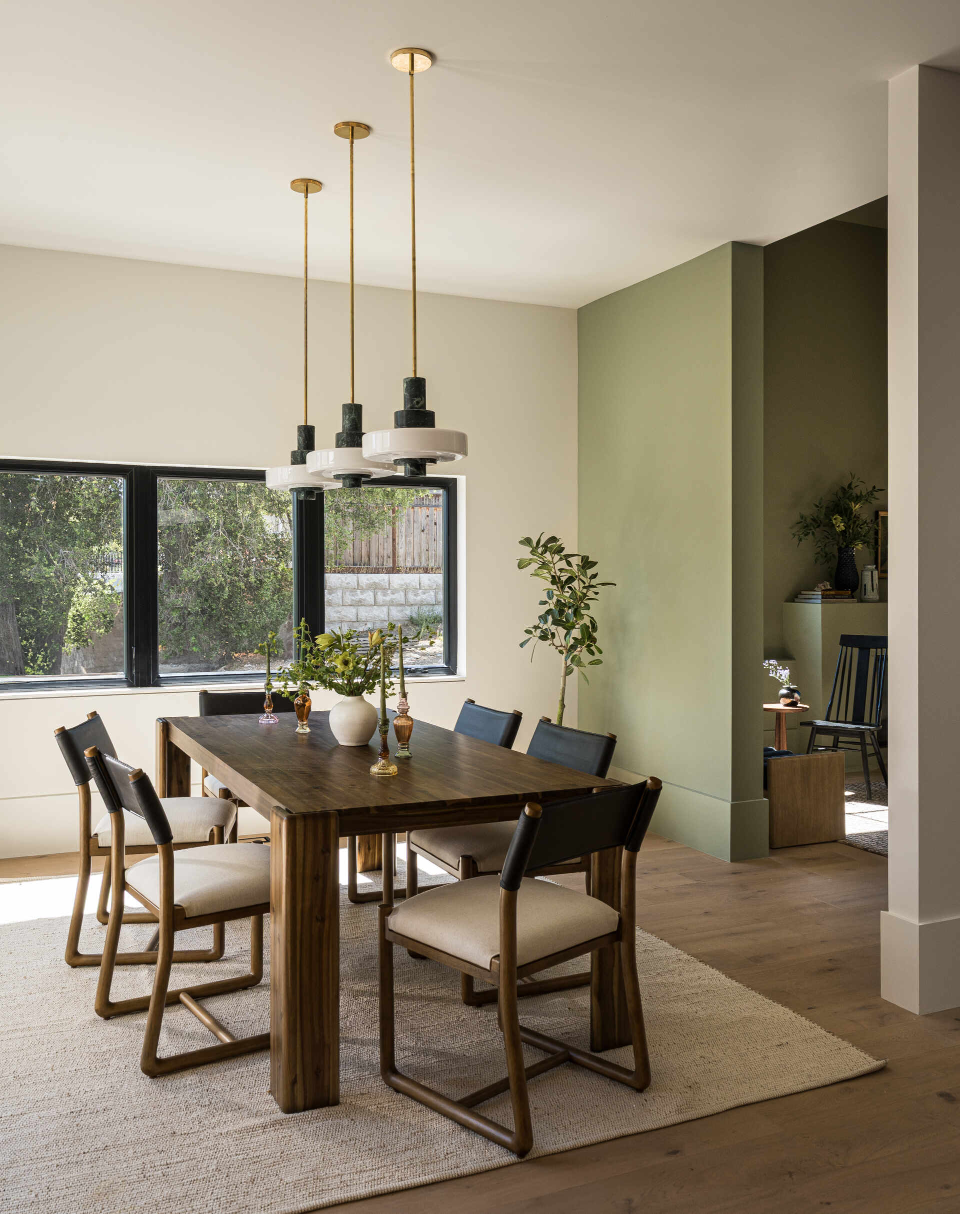 The formal dining room continues this approach, providing a dedicated area for hosting. Its placement allows it to feel intentional, while still benefiting from the home’s overall flow and access to light.
