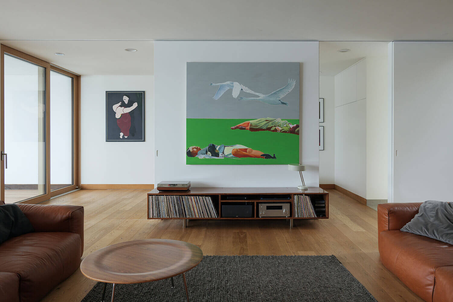 From a hidden TV room to an art-filled music space and a tree-facing studio, this home offers creative and flexible living areas.