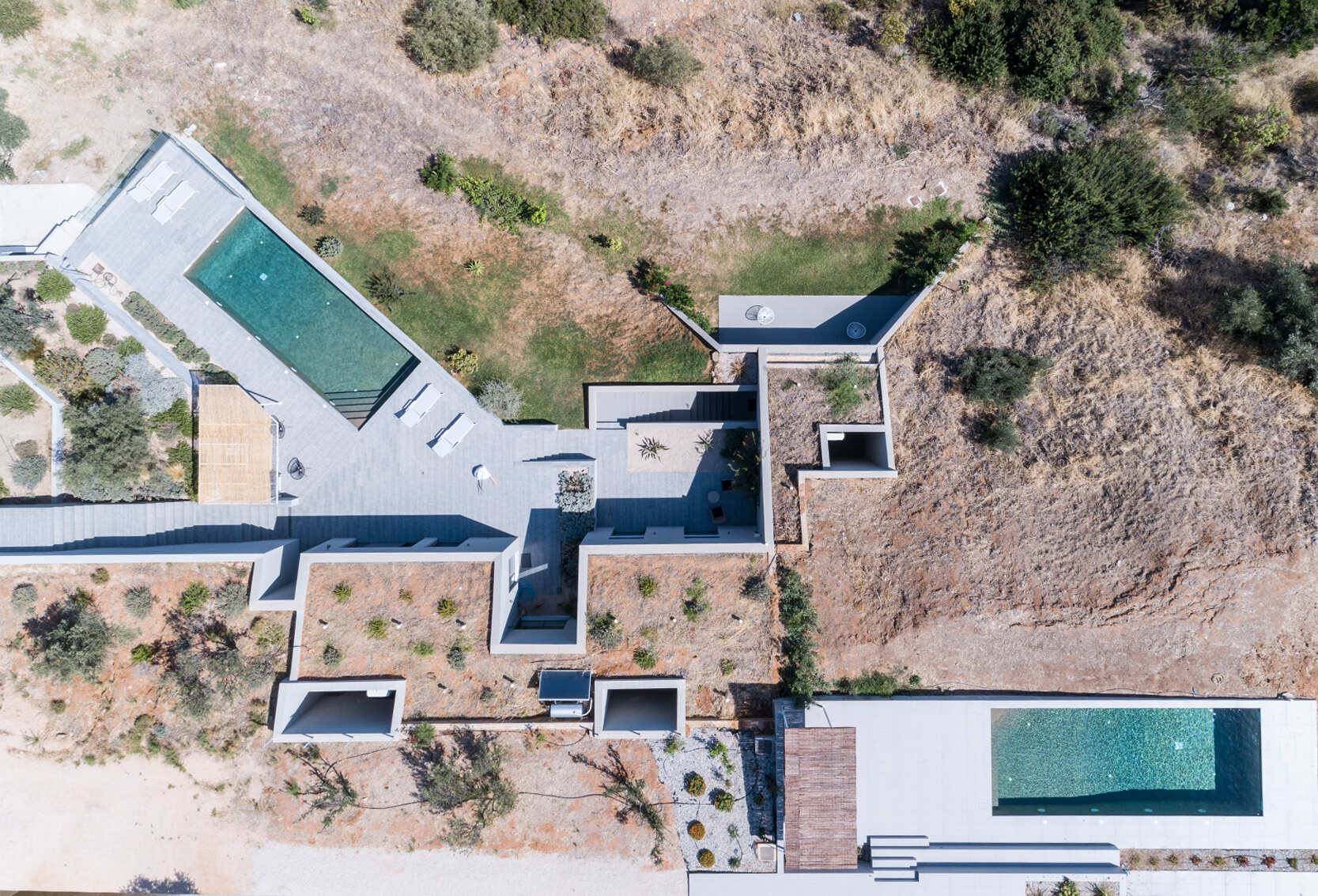 These hillside homes combine above-ground living with cave-like spaces, creating a seamless connection between architecture and terrain.
