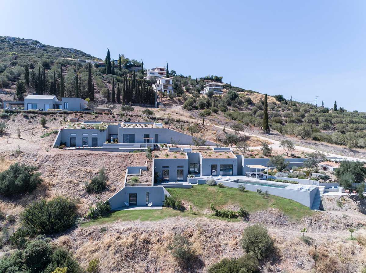 These hillside homes combine above-ground living with cave-like spaces, creating a seamless connection between architecture and terrain.