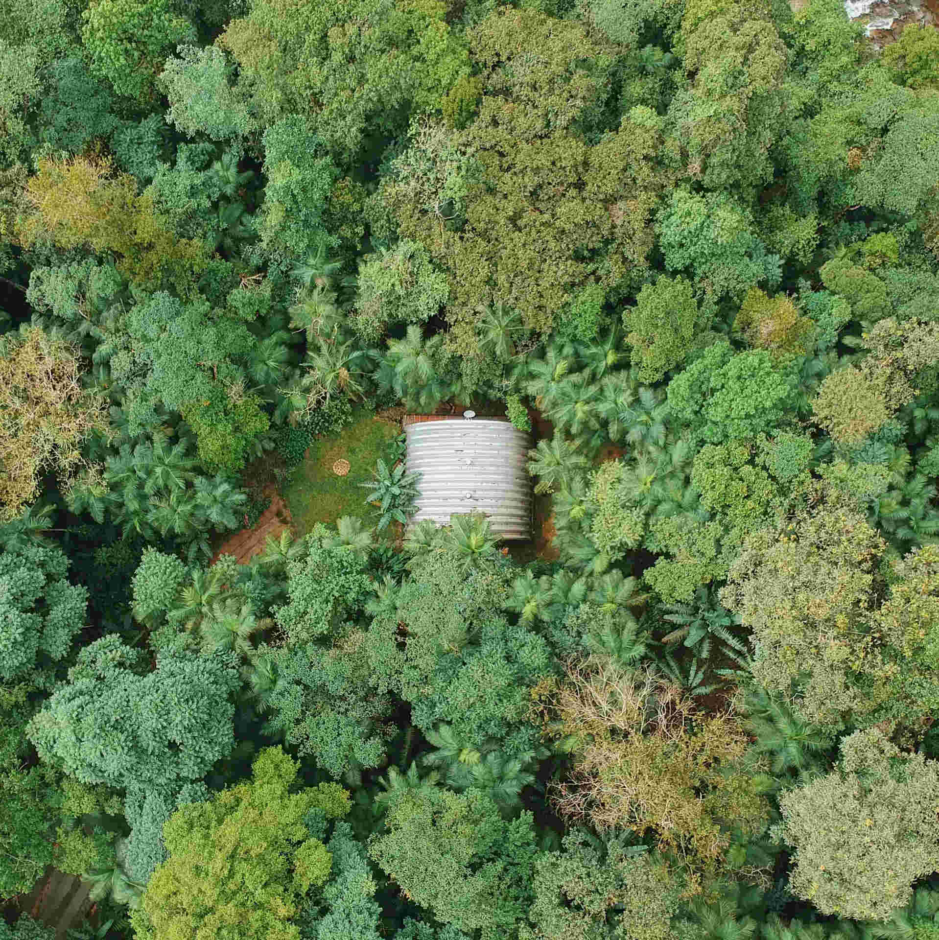 A modular arched structure made from lightweight metal panels that can be assembled in a week and relocated if needed.