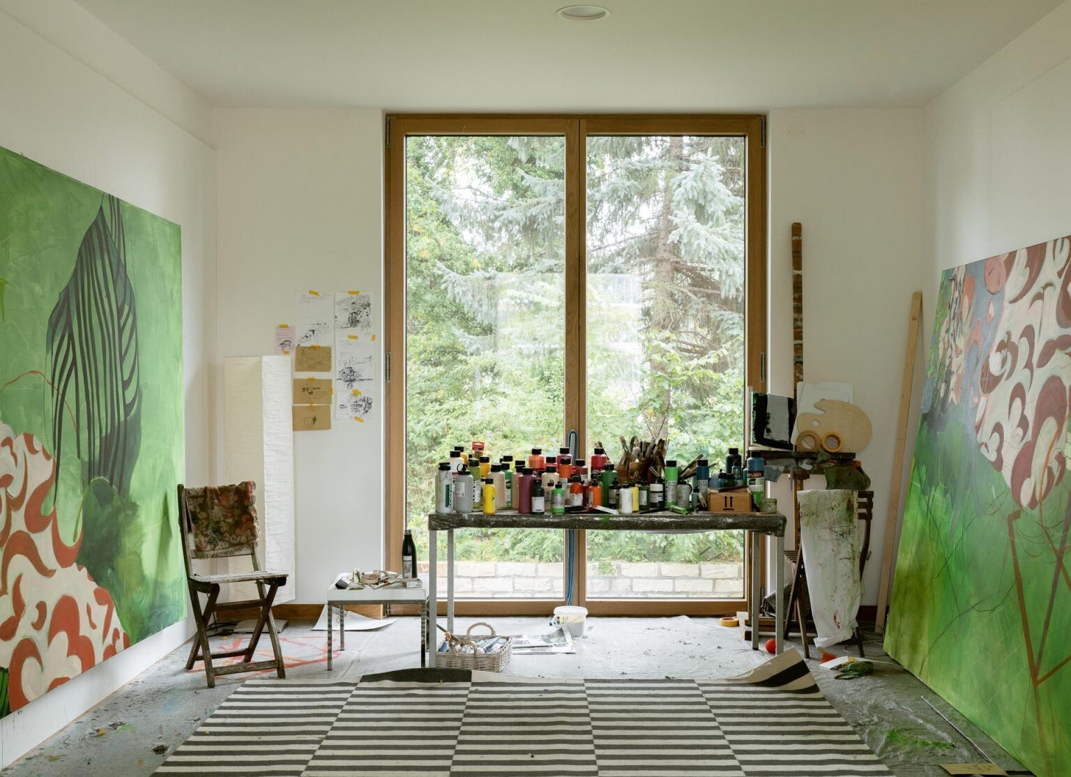 From a hidden TV room to an art-filled music space and a tree-facing studio, this home offers creative and flexible living areas.