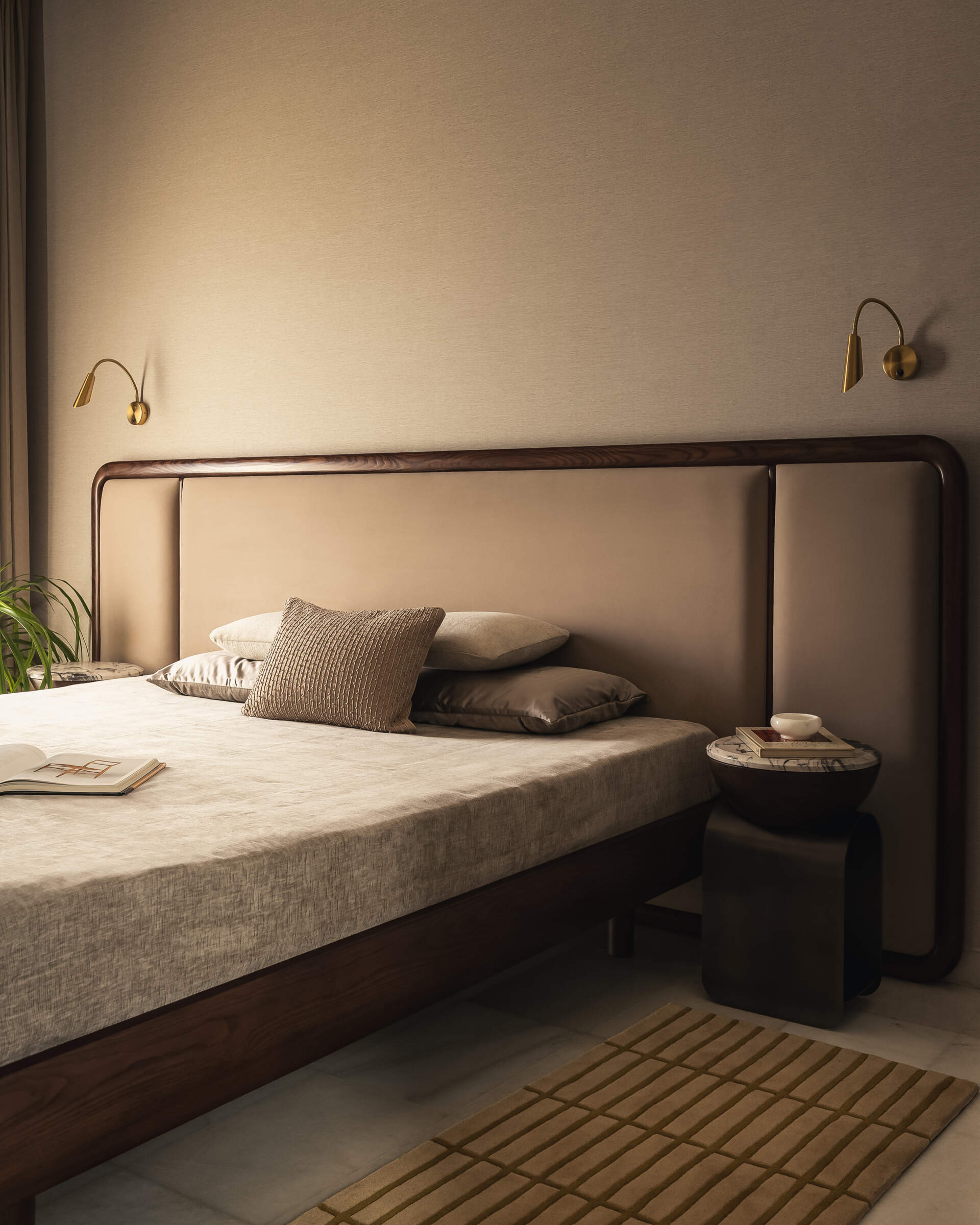 A modern bedroom with a neutral color palette.