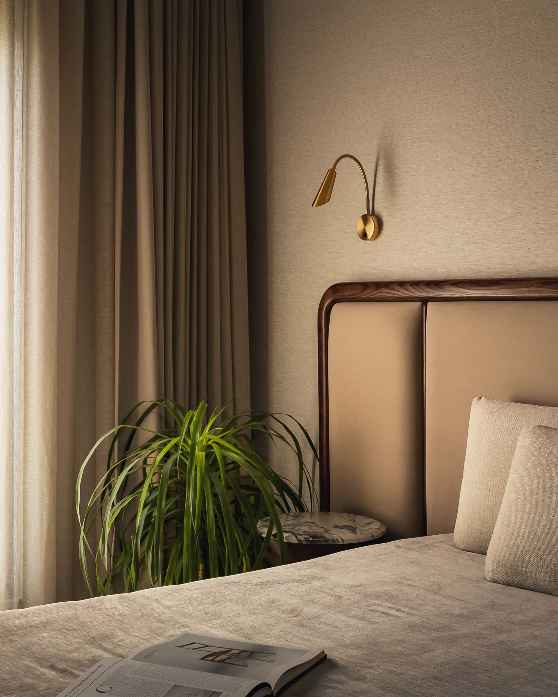 A modern bedroom with a neutral color palette.