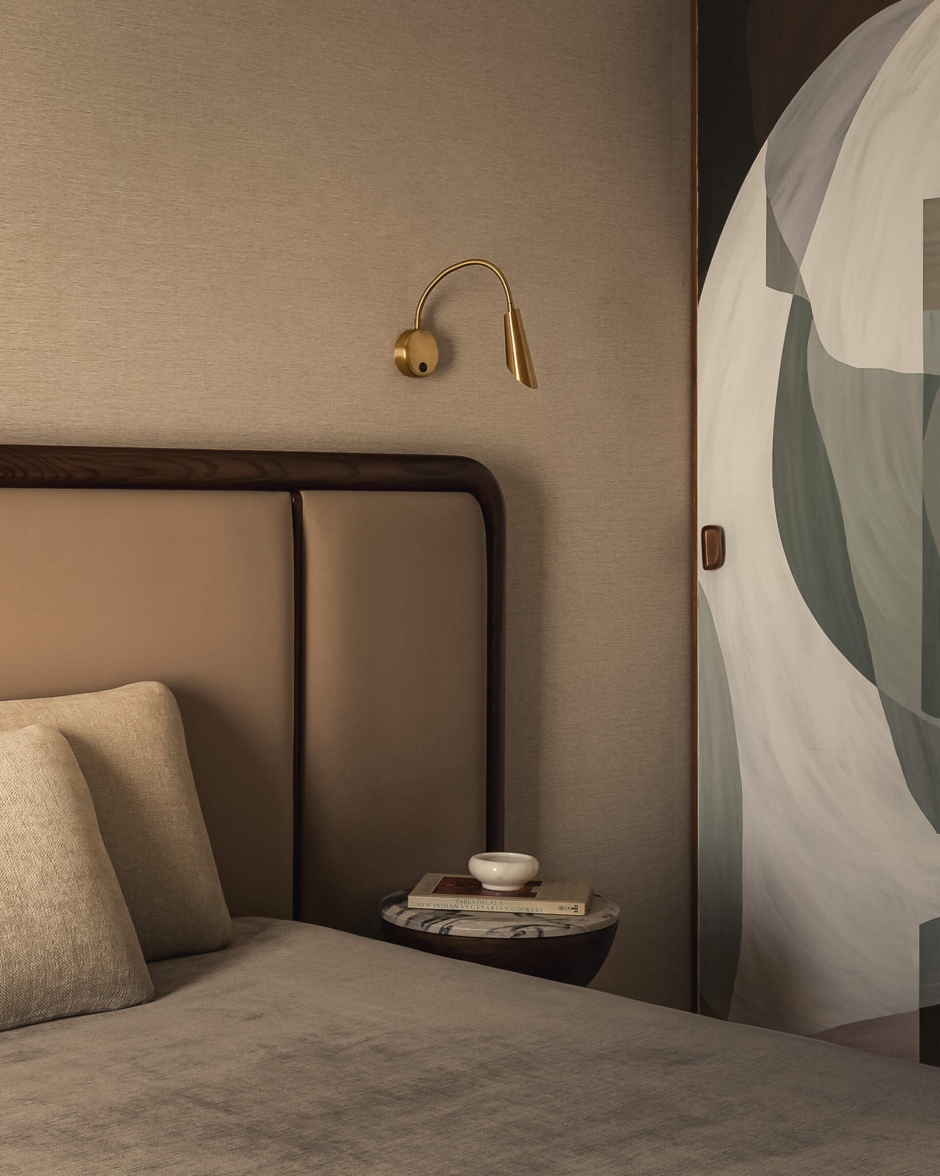 A modern bedroom with a neutral color palette.