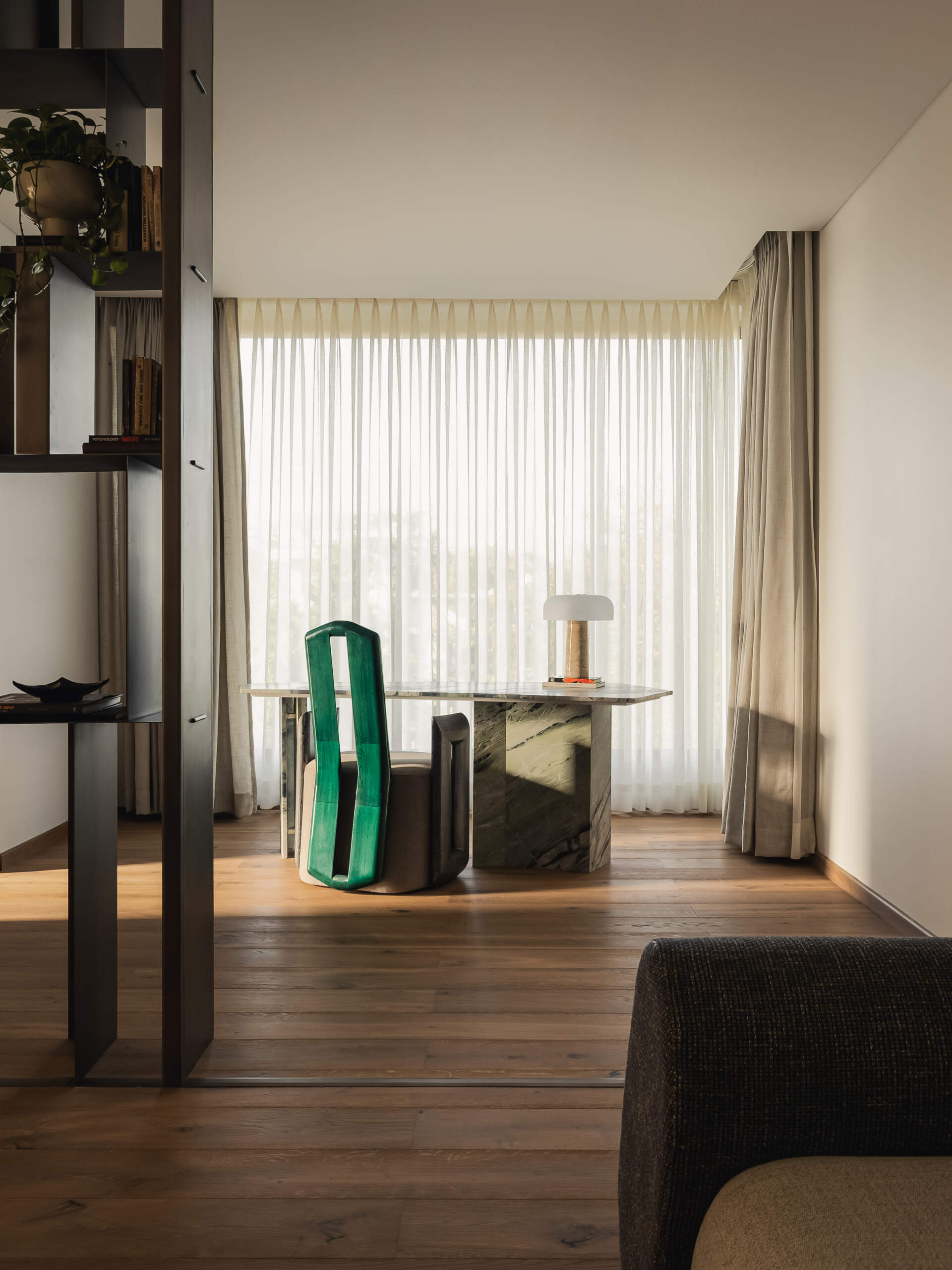 A modern bedroom with a home office area.
