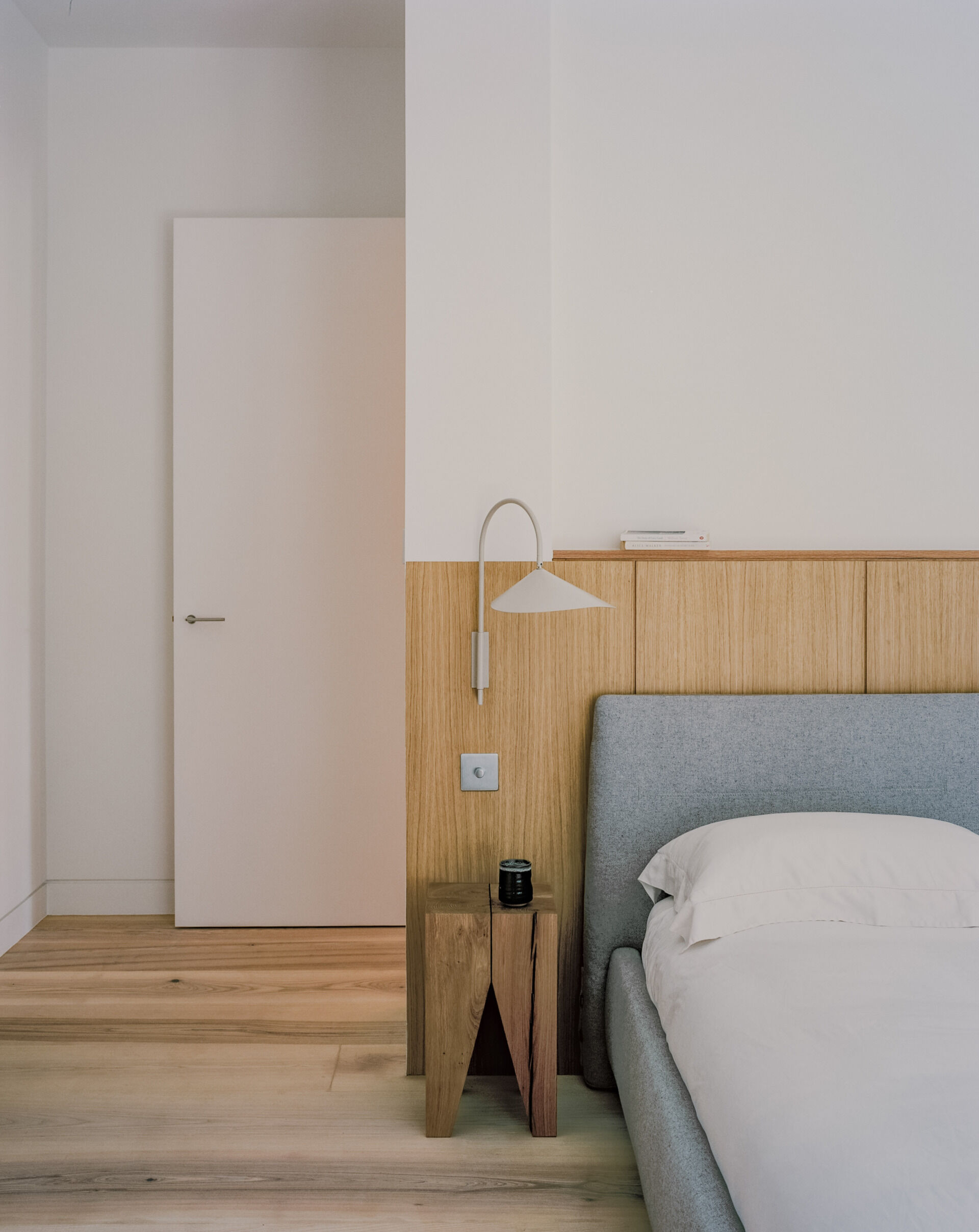 A private bedroom suite with an integrated office and a deep wood soaking tub blends function with standout design.