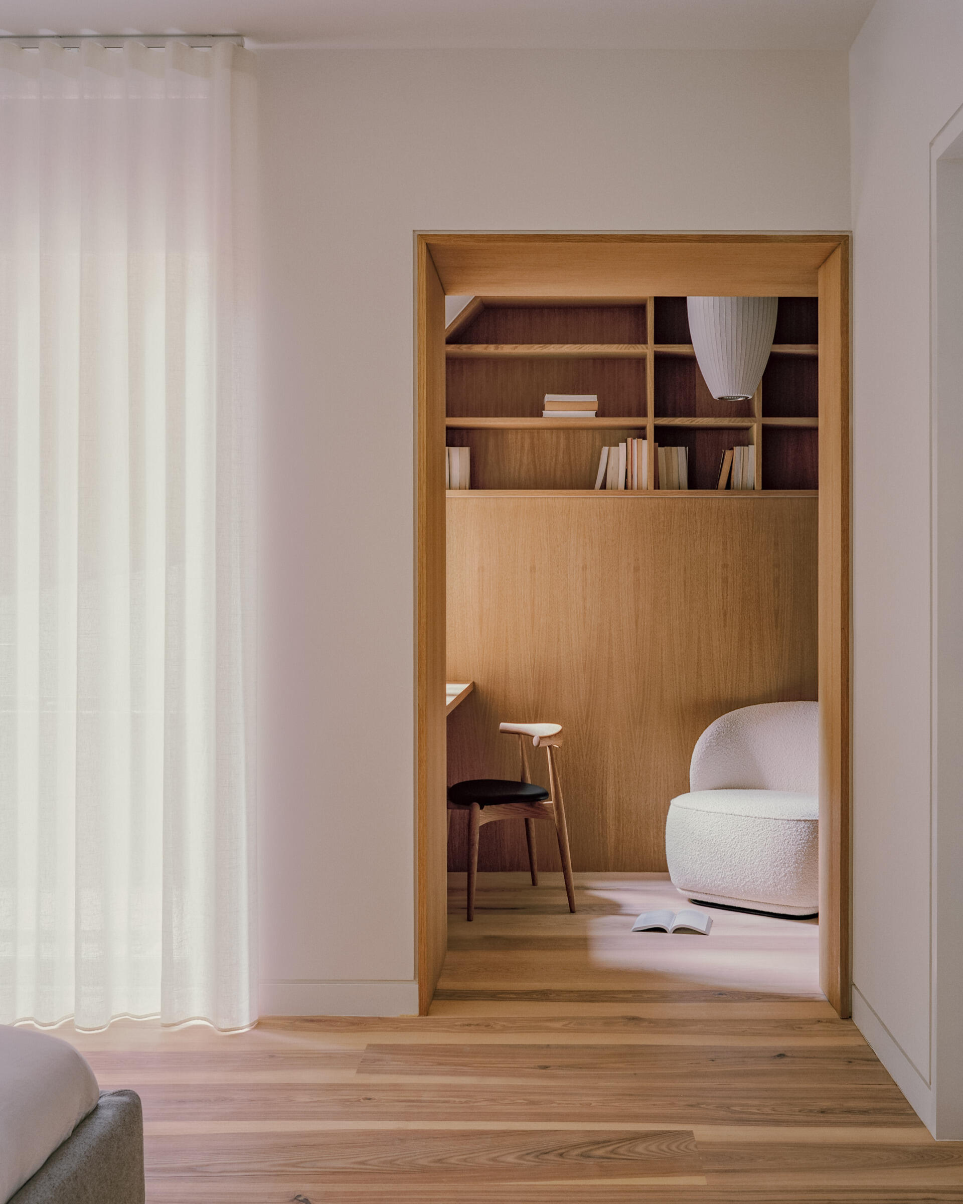 A private bedroom suite with an integrated office and a deep wood soaking tub blends function with standout design.