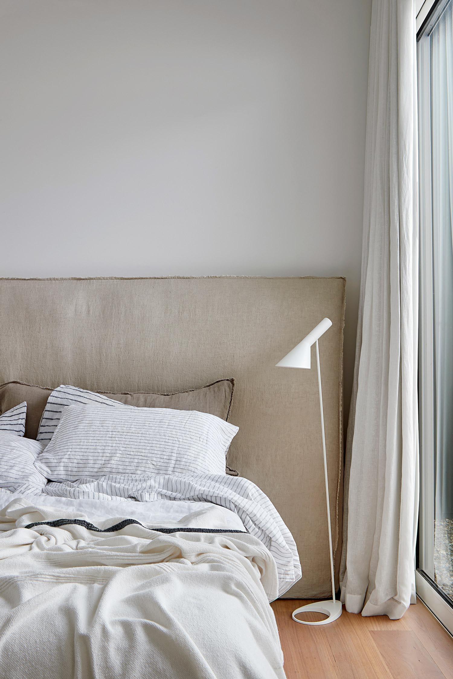 A serene bedroom with direct garden access, offering a private outdoor escape just steps from the bed.