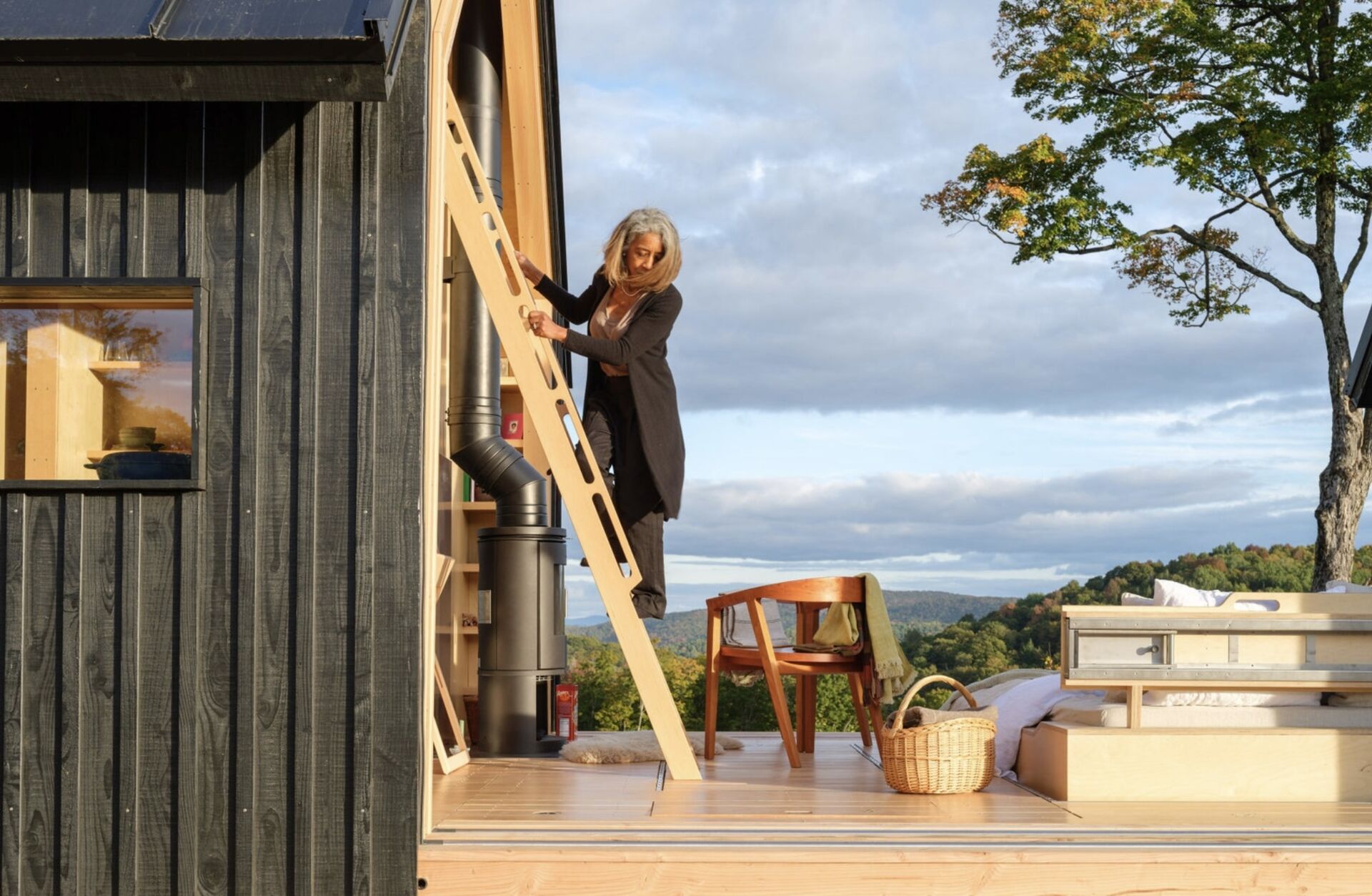 A small cabin in Vermont that physically transforms throughout the day. Cabin ANNA uses sliding timber and glass shells to create a space that can fully open to the outdoors in seconds.