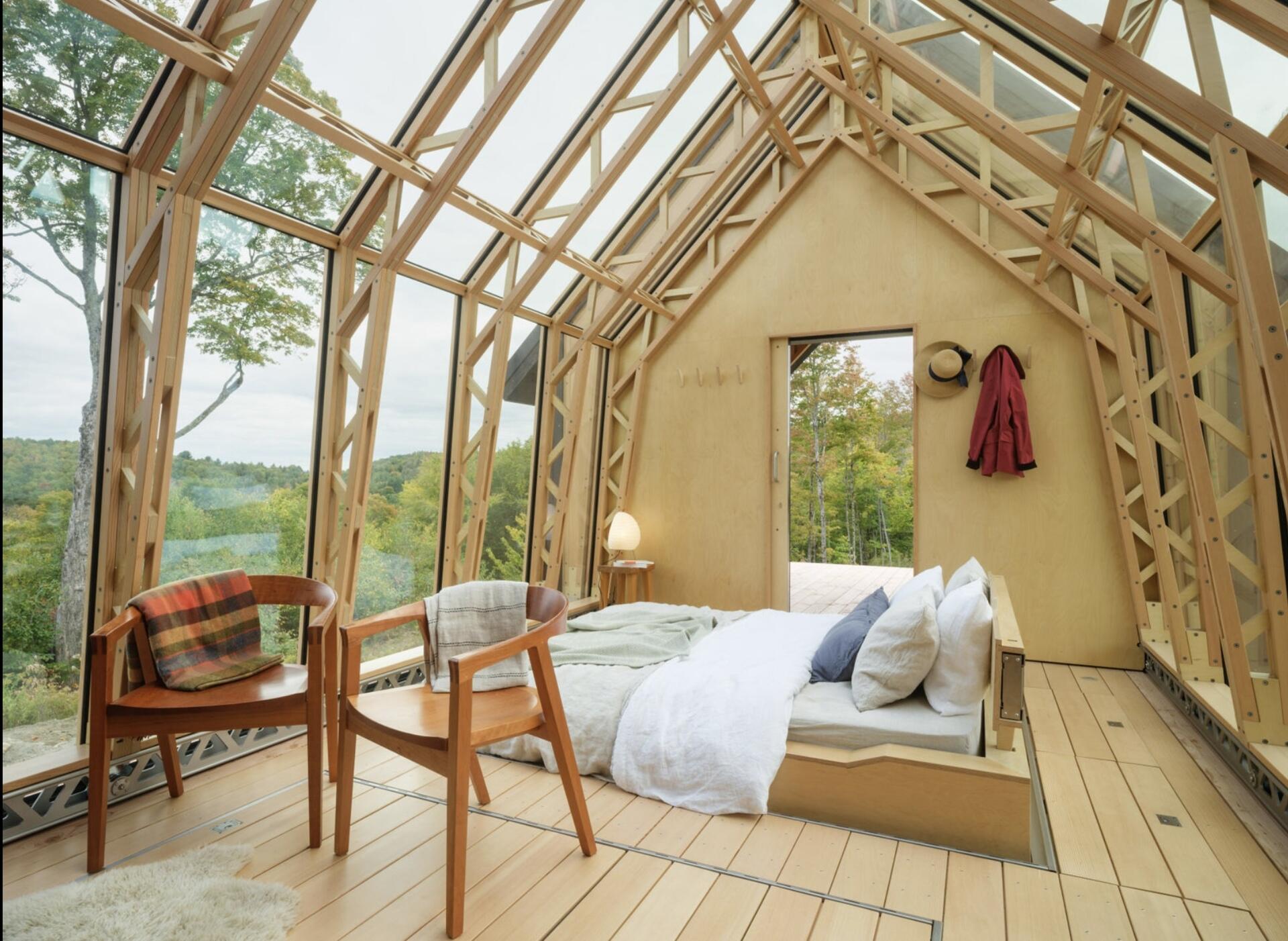 A small cabin in Vermont that physically transforms throughout the day. Cabin ANNA uses sliding timber and glass shells to create a space that can fully open to the outdoors in seconds.