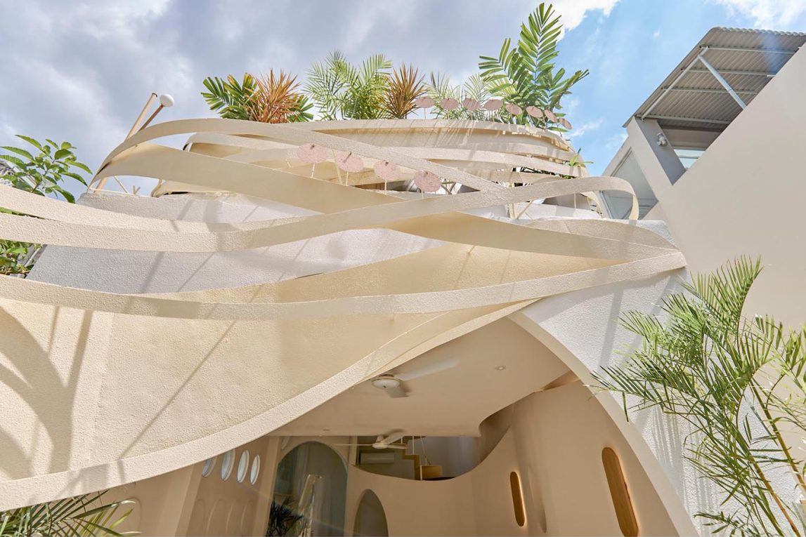 Layered outdoor seating areas offer different views and atmospheres across multiple café levels.