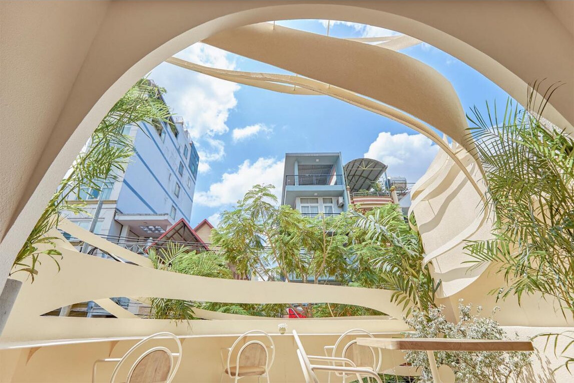 Layered outdoor seating areas offer different views and atmospheres across multiple café levels.