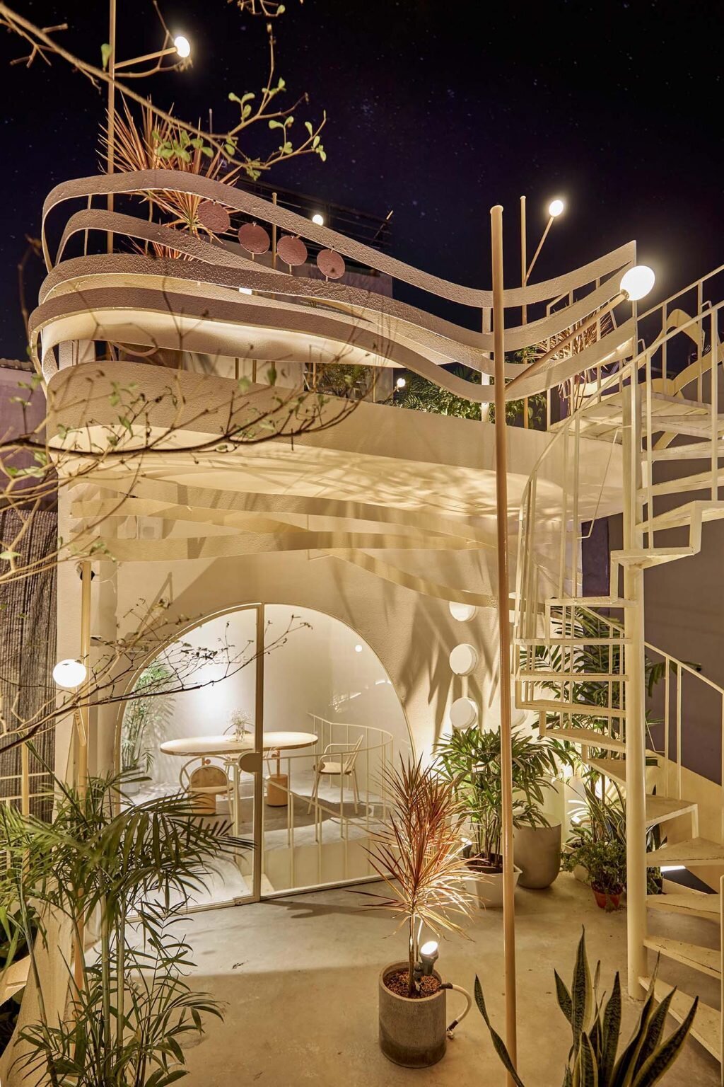 Layered outdoor seating areas offer different views and atmospheres across multiple café levels.