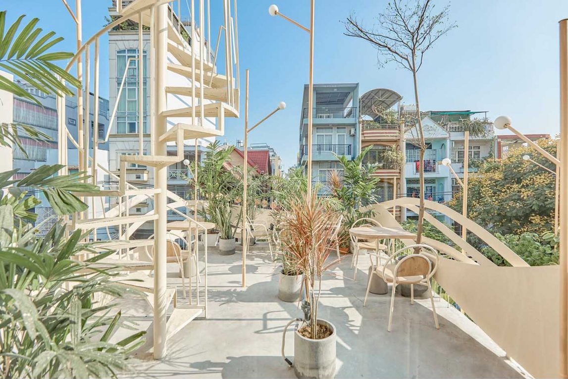 Layered outdoor seating areas offer different views and atmospheres across multiple café levels.