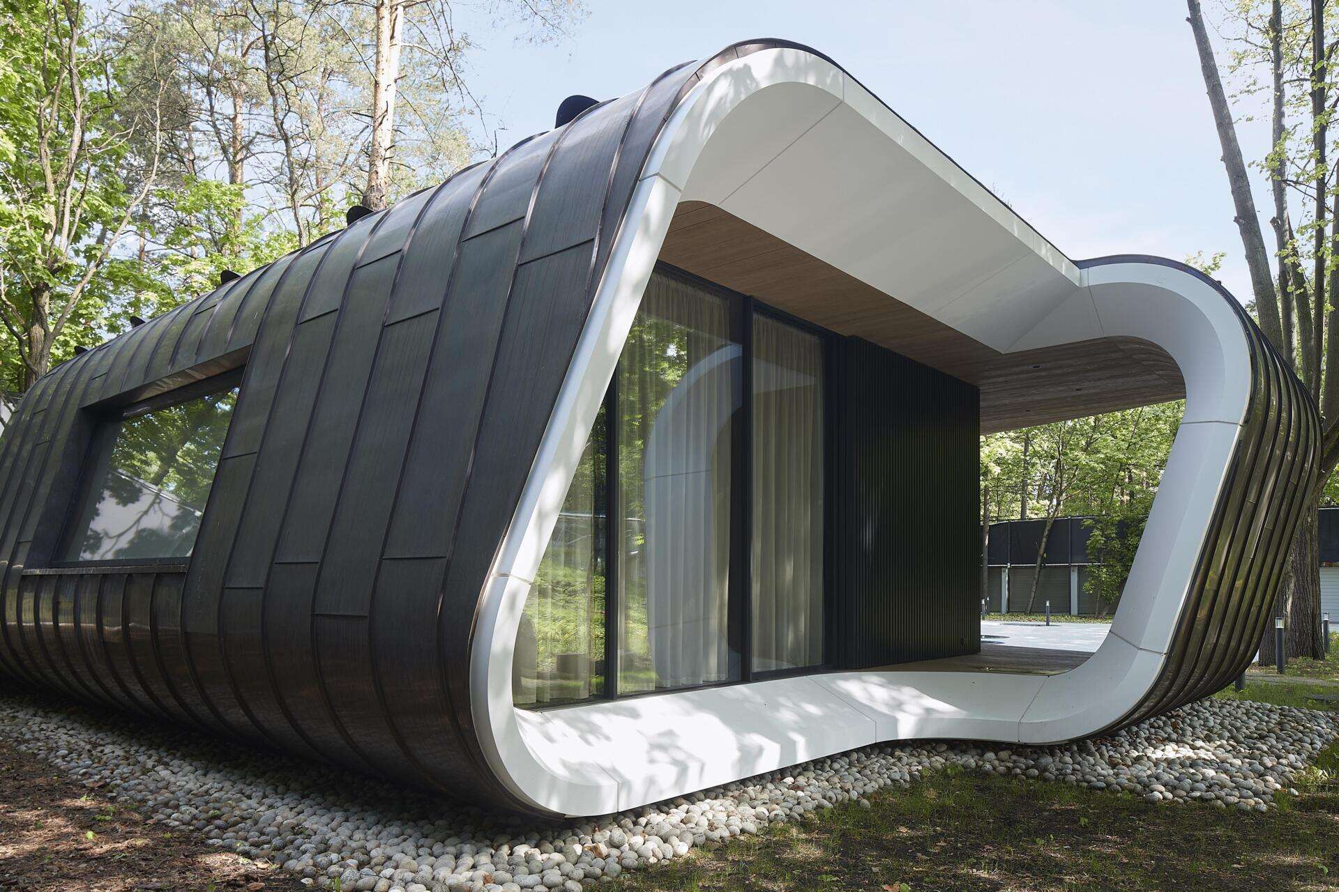 A modern garage by ATRIUM expands a private estate, turning car storage into a striking architectural feature in a forest setting.