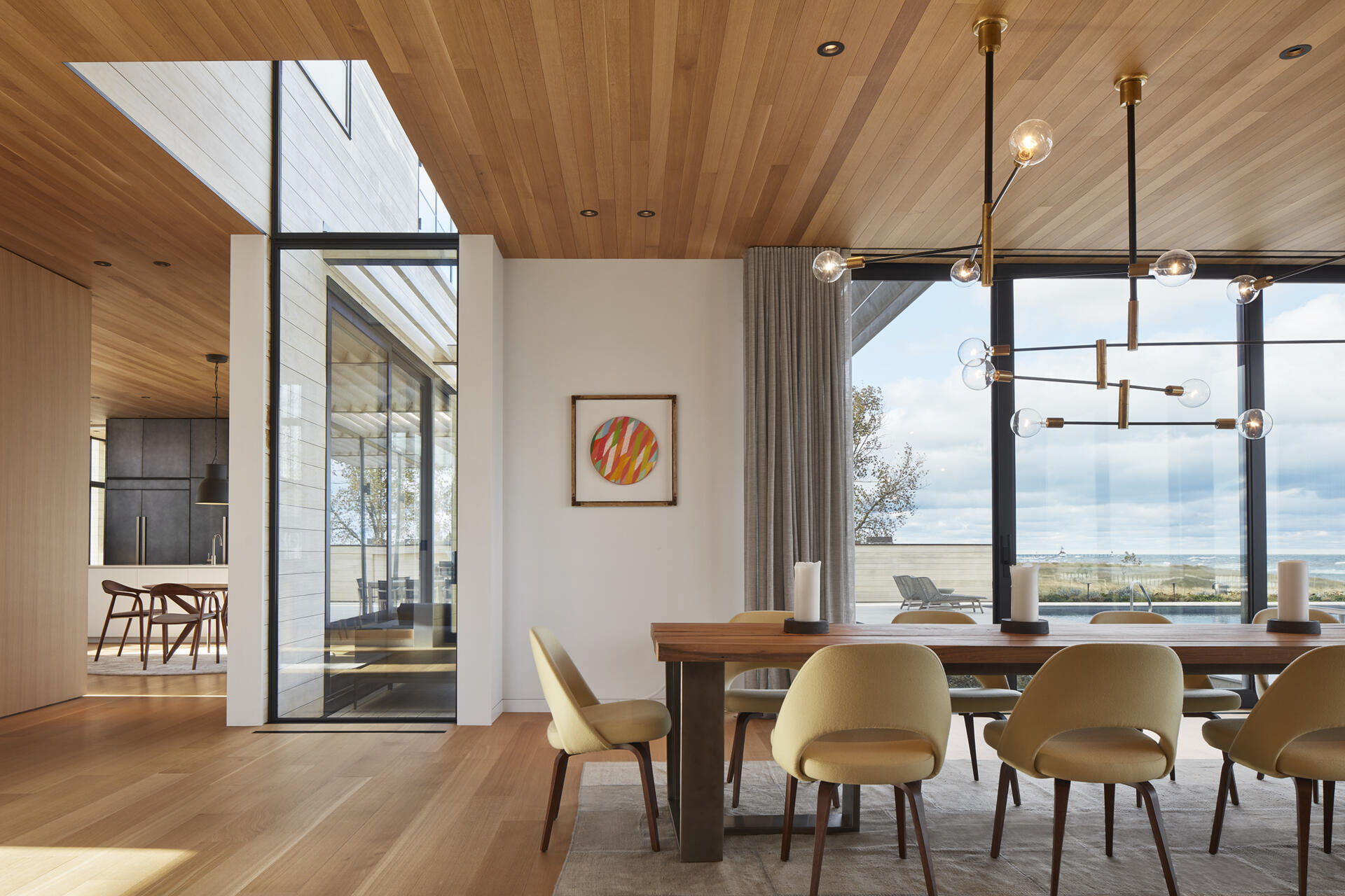 A dining room with uninterrupted lake views brings natural light and scenery into every meal.