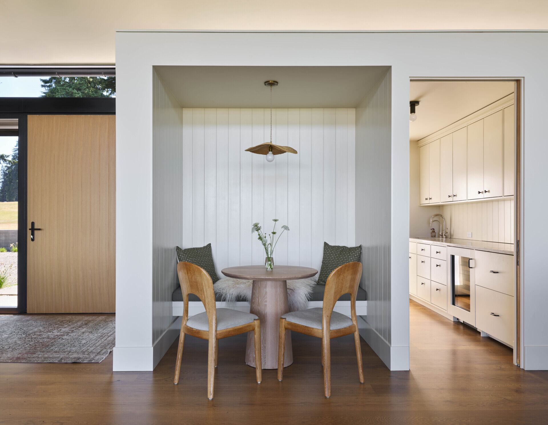 A cozy breakfast nook offers a relaxed spot for morning meals with plenty of natural light.