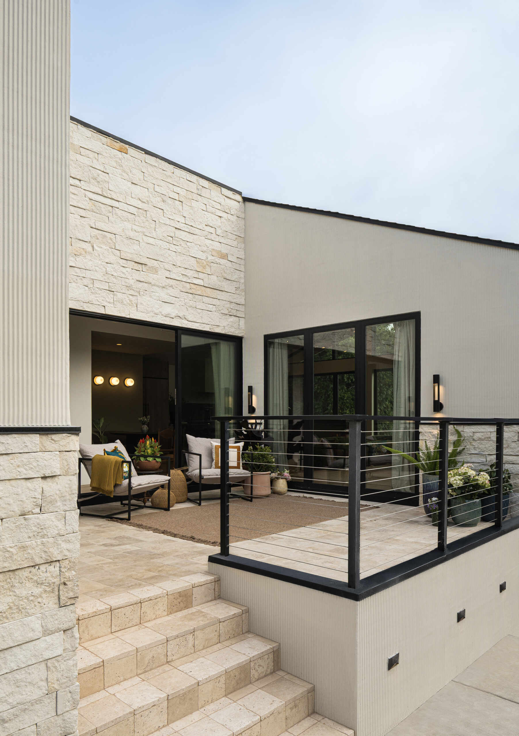 Positioned between key living spaces, this patio acts as a connector. It draws daylight deeper into the home and creates an easy transition between indoors and outdoors, reinforcing how the house opens up despite its tight surroundings.