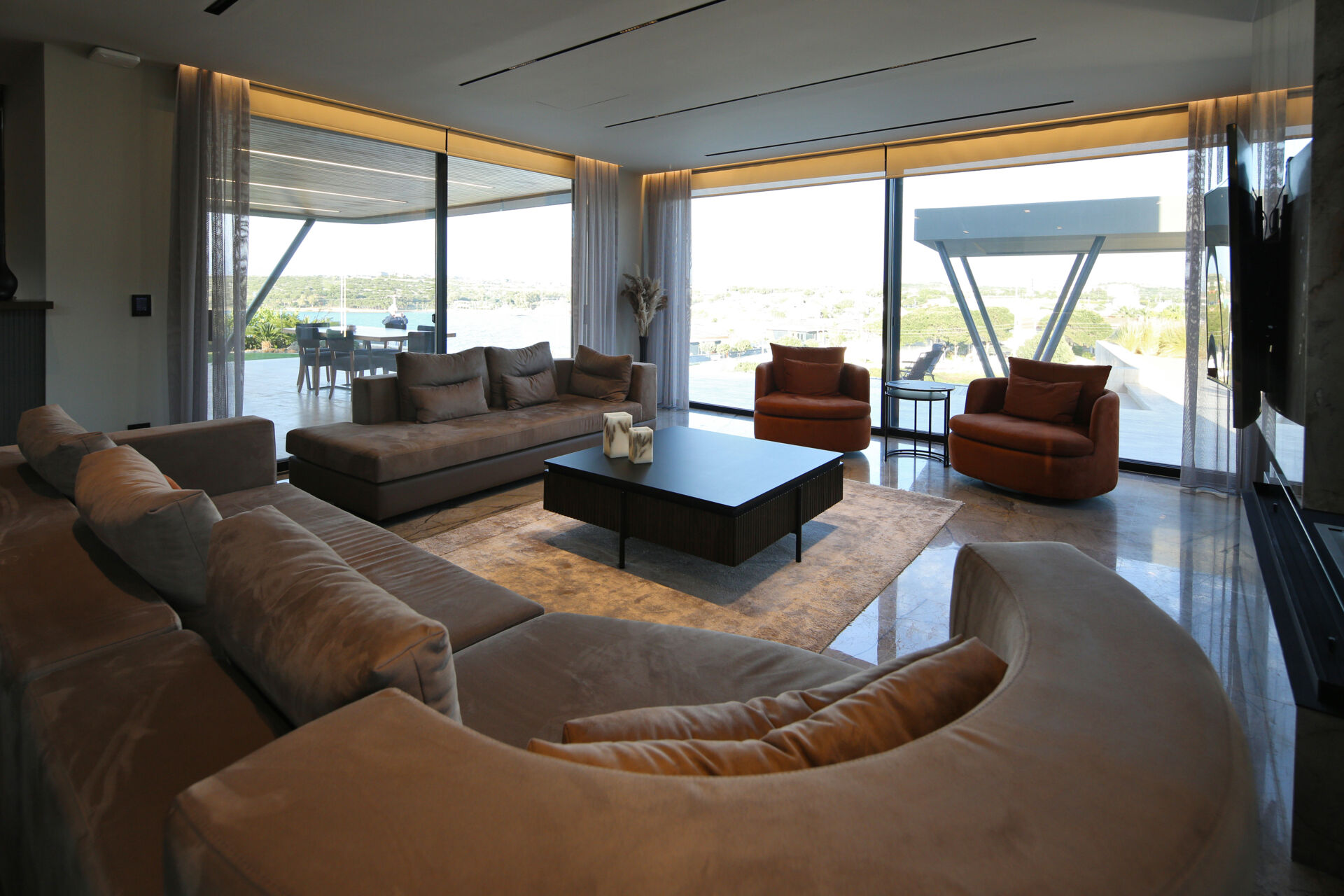 Open-plan living spaces that flow directly to a poolside terrace, blending indoor comfort with outdoor relaxation.