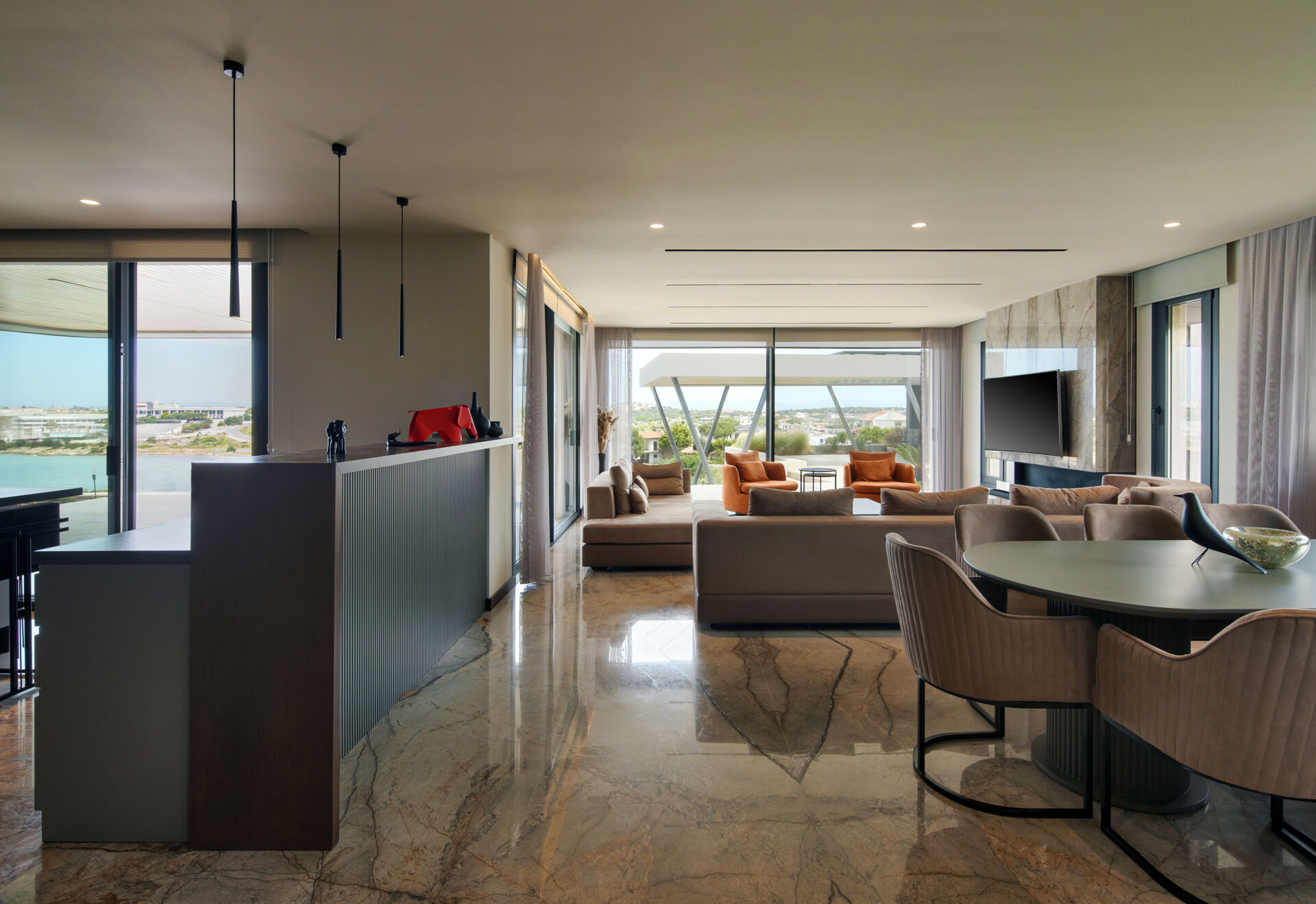 Open-plan living spaces that flow directly to a poolside terrace, blending indoor comfort with outdoor relaxation.