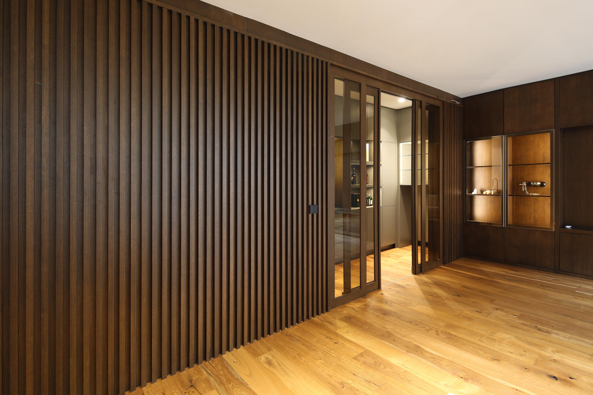 A multifunctional basement level featuring a lounge, wine and cigar room, sauna, and direct garden access.