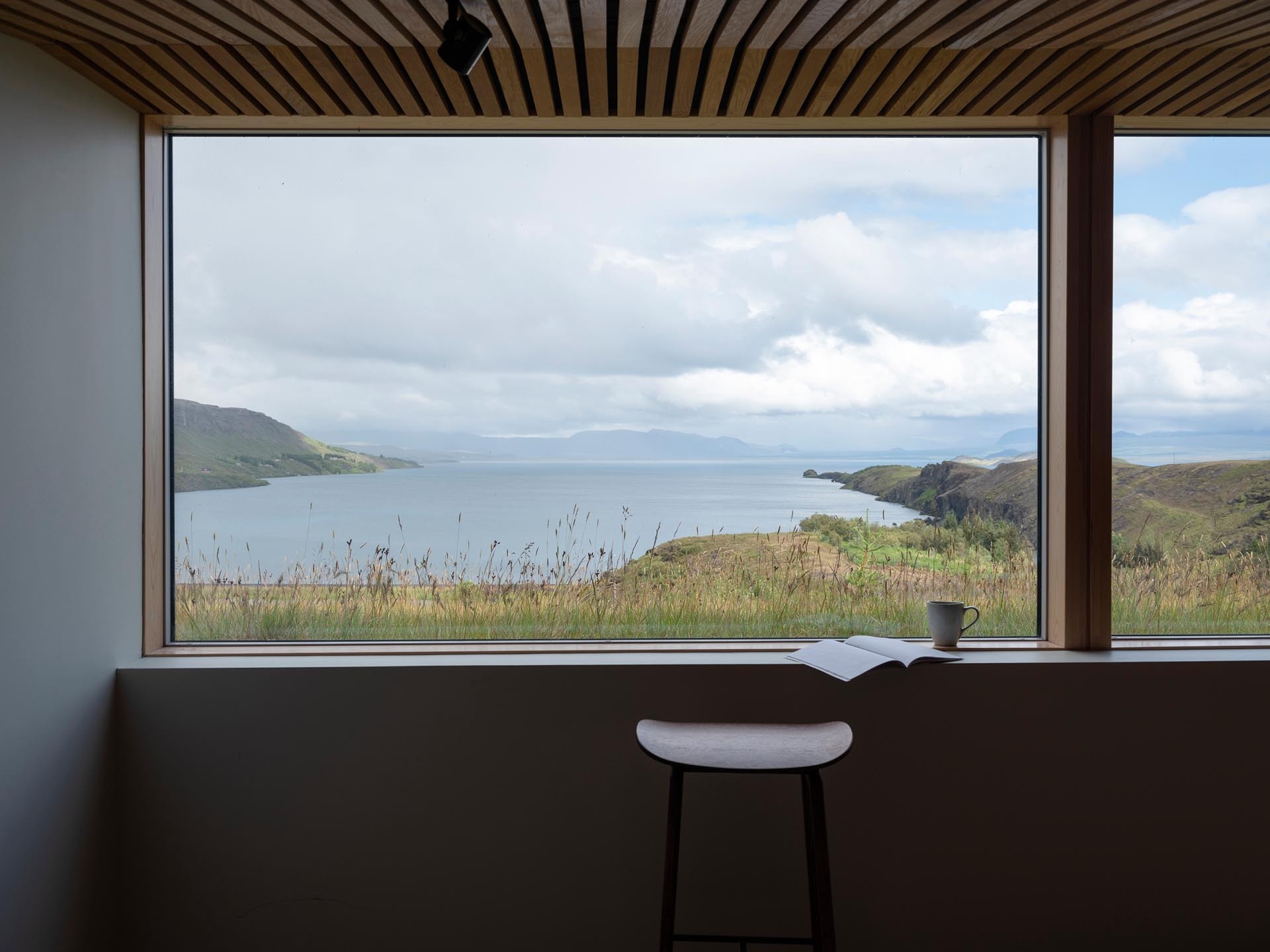 A carefully placed window frames the Icelandic landscape like artwork, turning the view into a focal point.