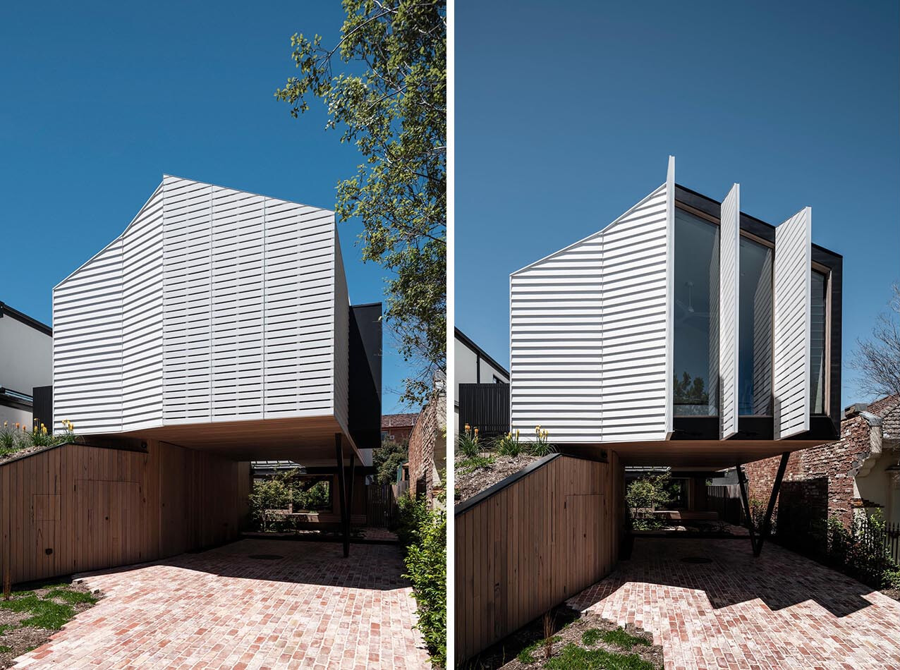 A modern home designed to engage with its surroundings, blending a floating form with open, welcoming outdoor spaces that extend toward the street.