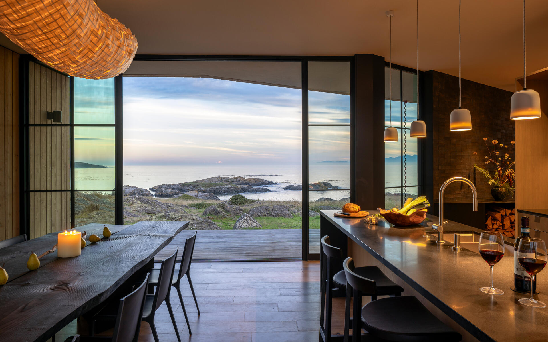 An 11-foot dining table anchors this open-plan space designed for gathering and connection. The kitchen flows naturally from this space, keeping everything connected and open.
