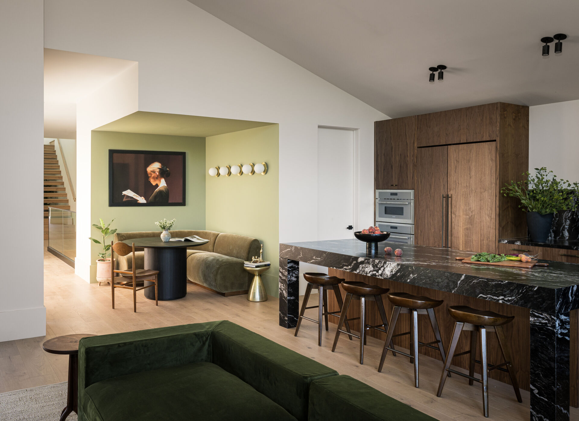 Adjacent to the kitchen, the breakfast nook, highlighted in green, offers a more casual place to gather. Its position allows it to benefit from natural light while staying closely tied to the main cooking and living areas.