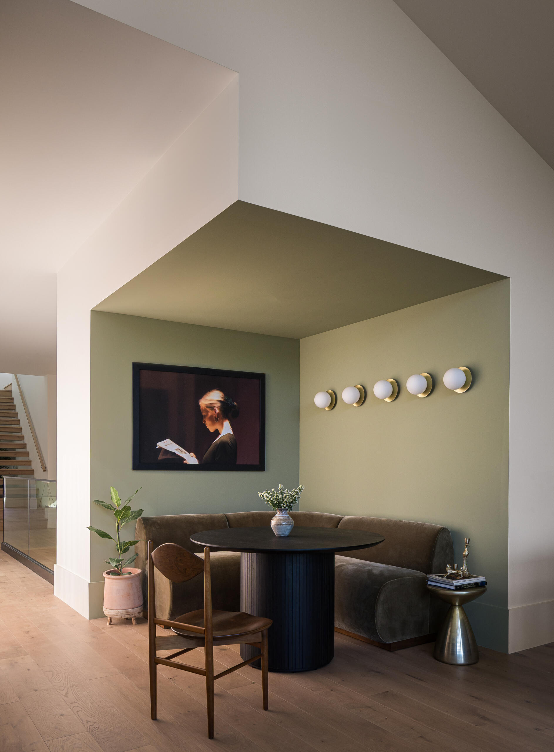 Adjacent to the kitchen, the breakfast nook, highlighted in green, offers a more casual place to gather. Its position allows it to benefit from natural light while staying closely tied to the main cooking and living areas.