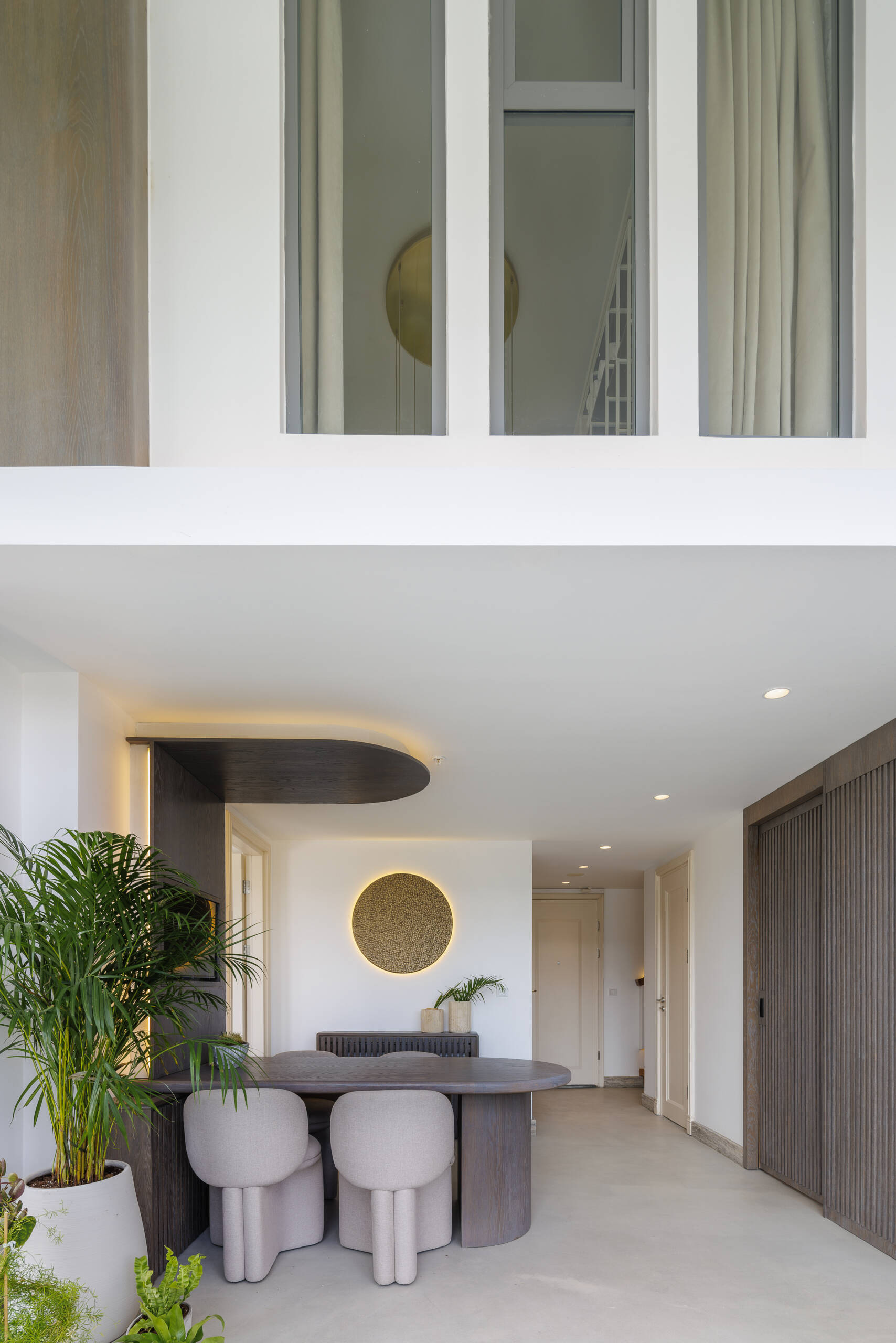 A balanced interior of a loft apartment, where contrast becomes harmony, blending softness, structure, and natural materials into one cohesive space.